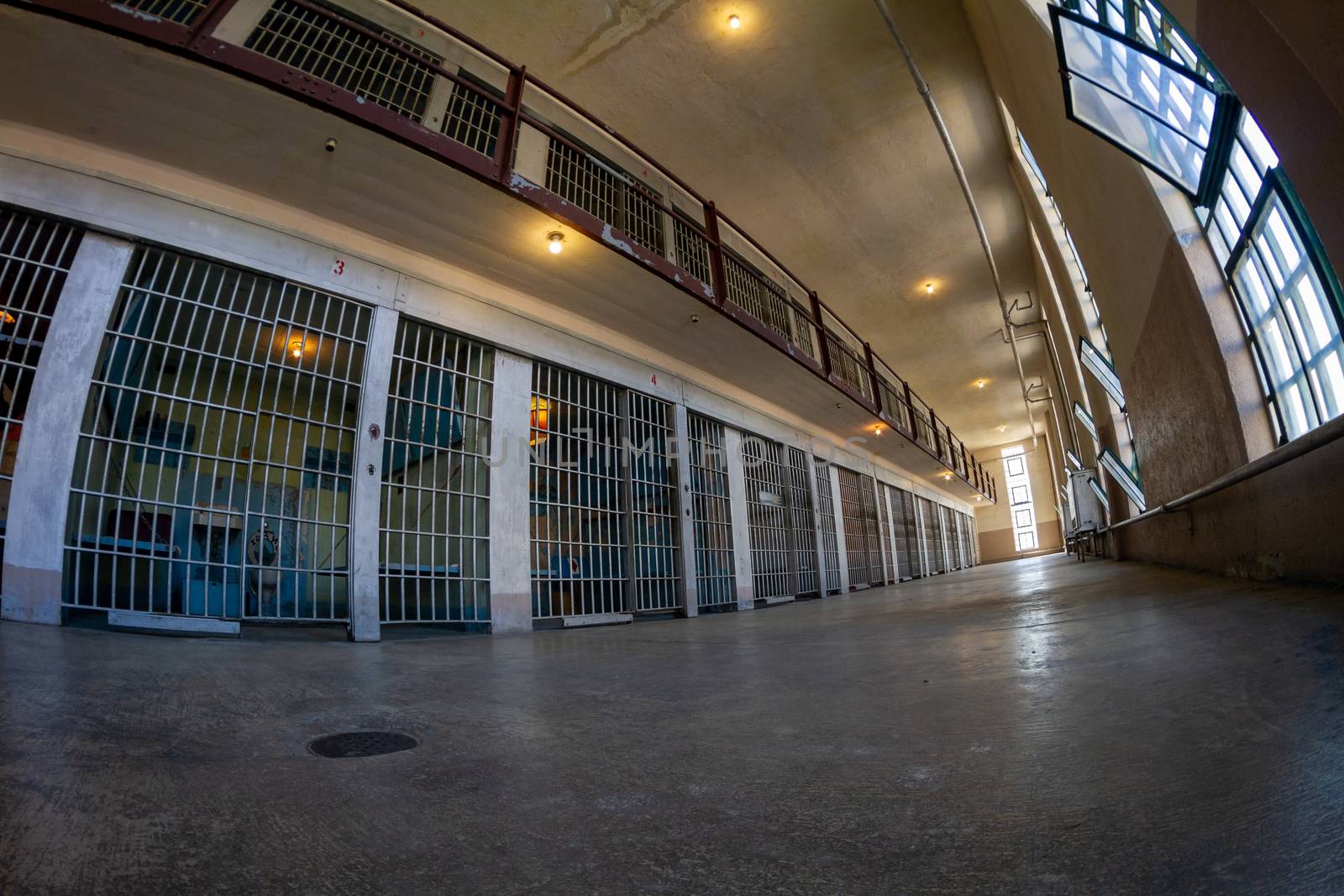 Fisheye view of prison bars with a low perspective