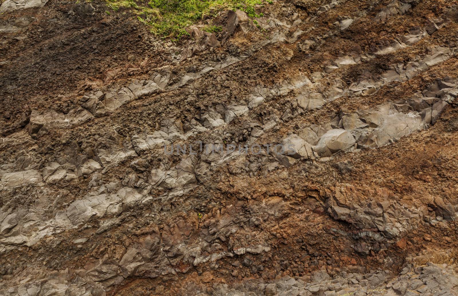 A cut of soil with rocks and red soil by igor_stramyk