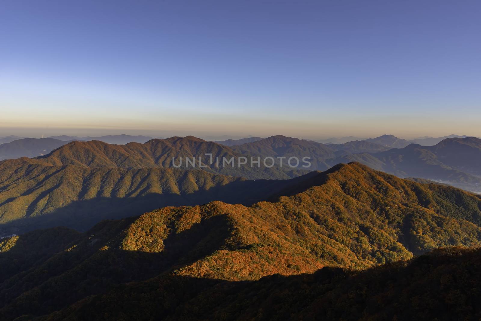 Morning mist in autumn on the peak of Cheonmasan mountain in Seoul, South Korea