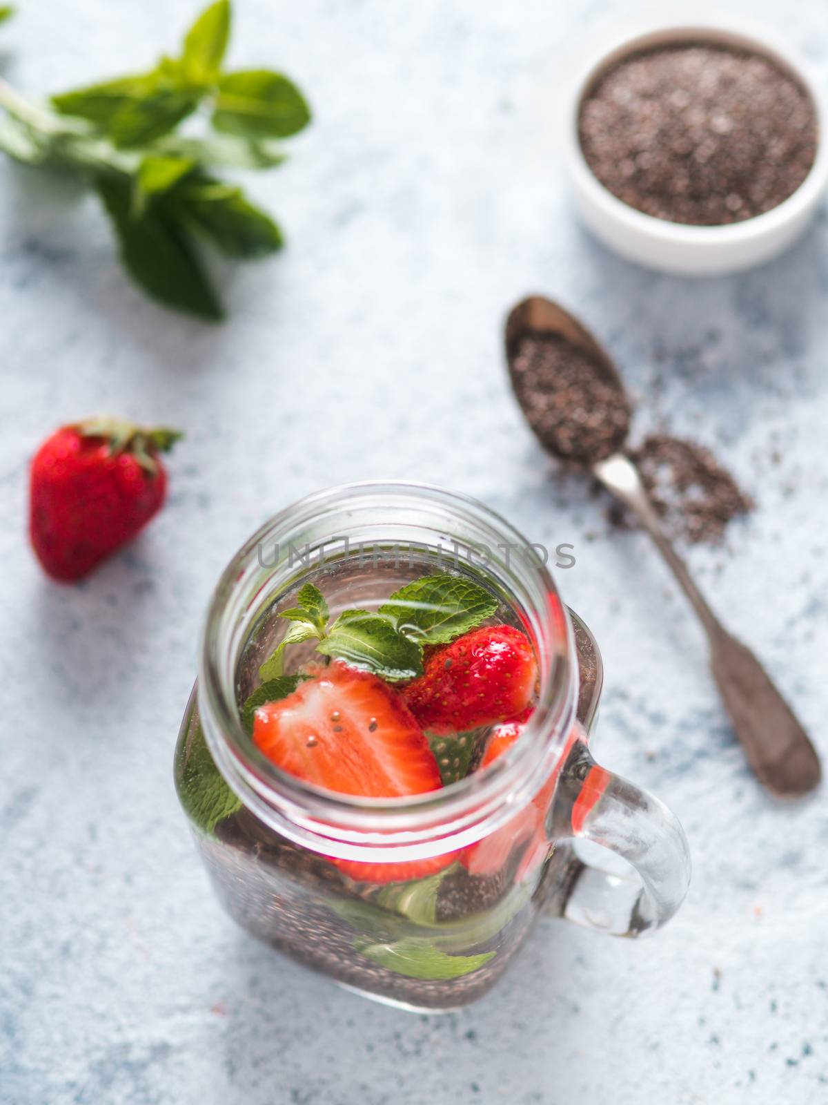 strawberry and mint chia water in mason jar by fascinadora
