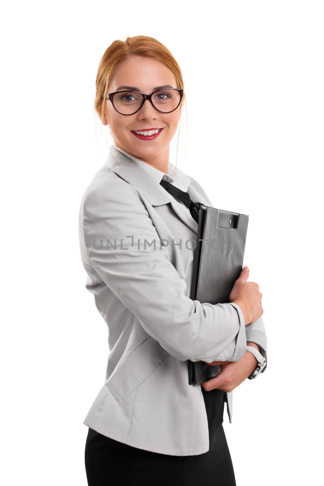 Portrait of a beautiful smiling young fashionable businesswoman holding a clipboard, isolated on white background.