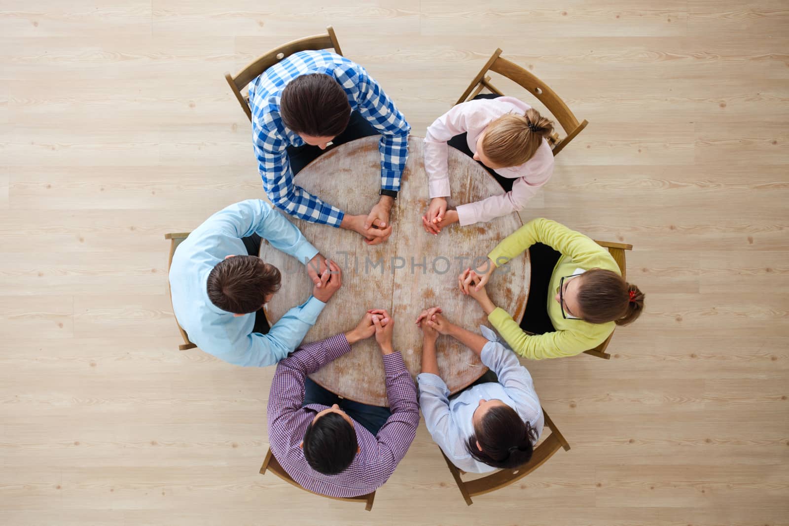 Startup diversity teamwork brainstorming meeting concept, people sitting around the table