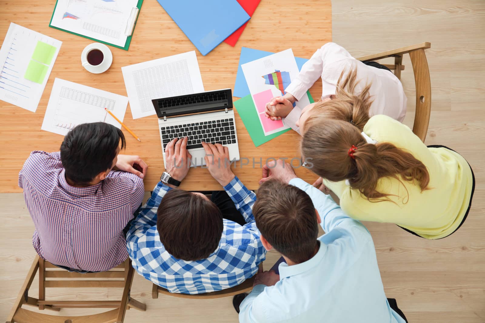 Business team meeting, people in casual clothes working with financial statistics at office desk