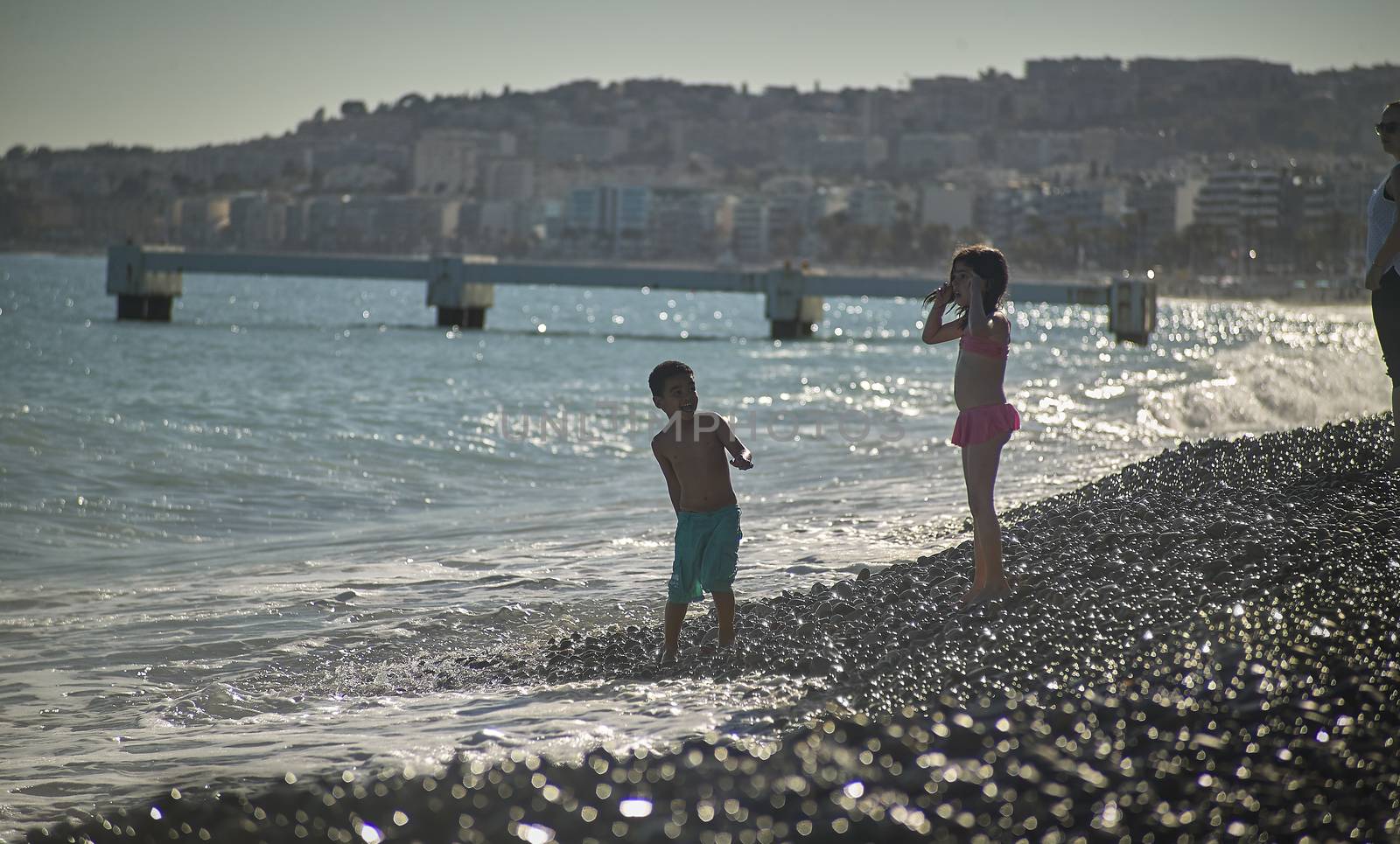 Children playing on the beach by pippocarlot