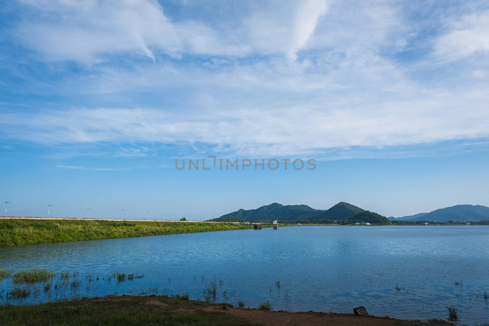 The Sea landscape with boats against the mountains, beautiful white clouds by peerapixs