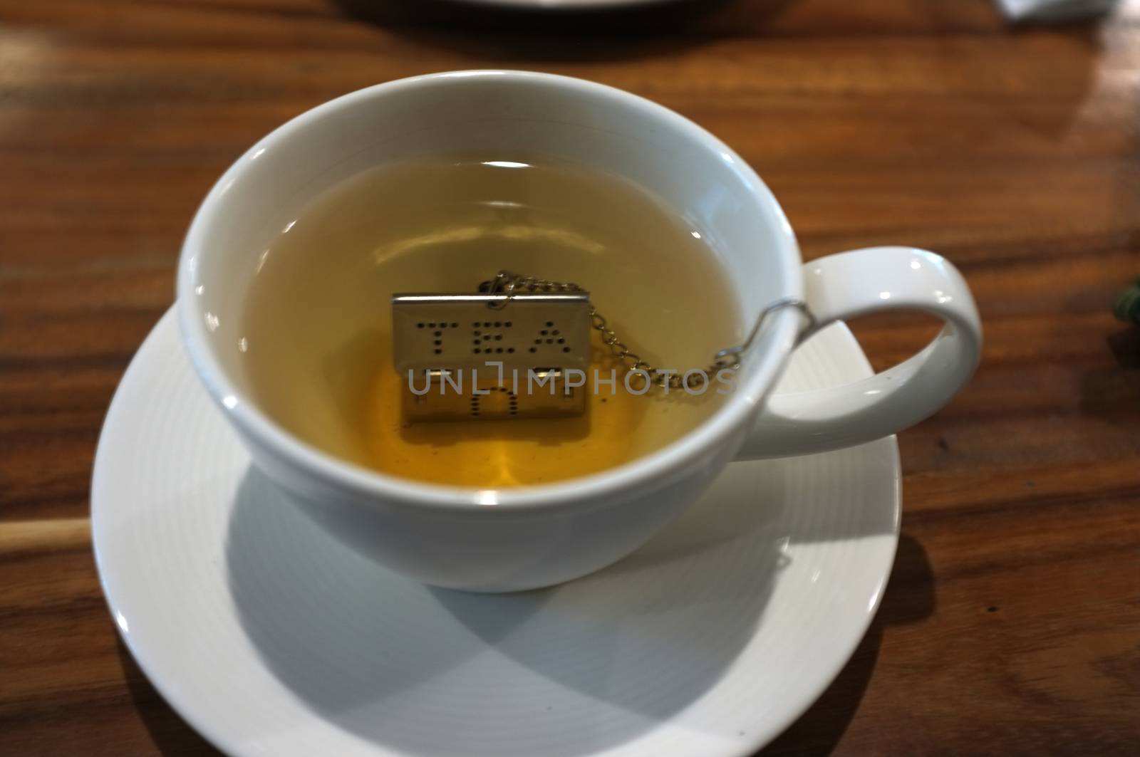 Cup of tea with House Shape Tea Strainers Stainless Steel Tea Infusers