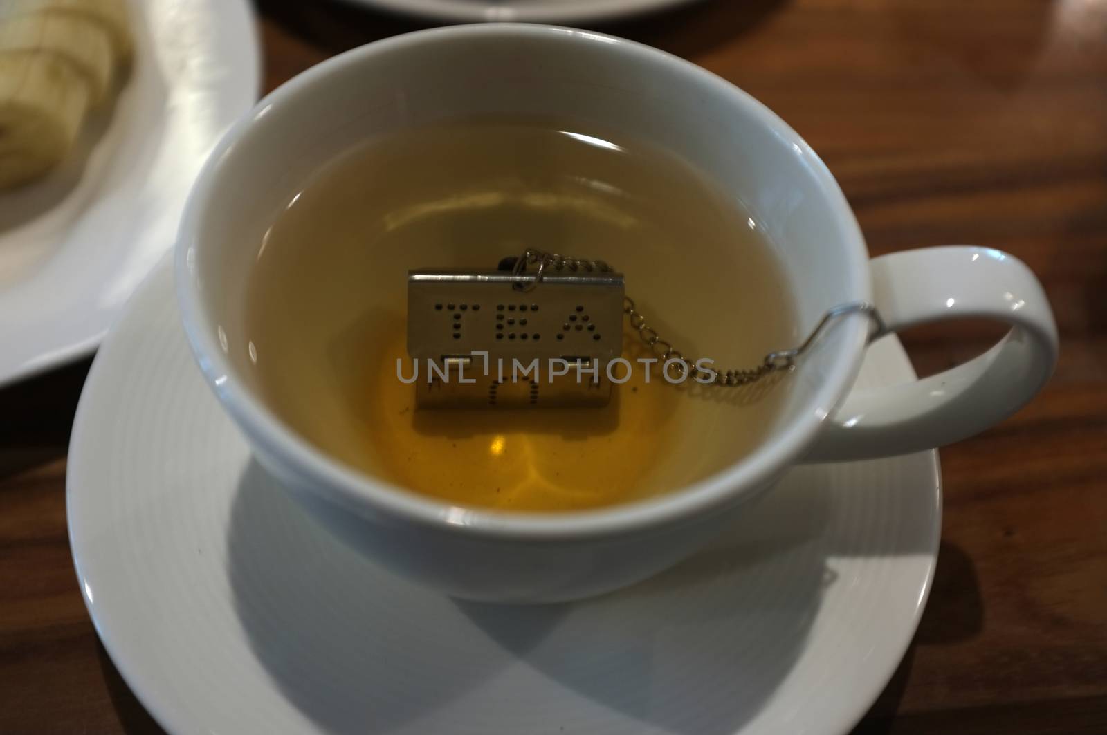 Cup of tea with House Shape Tea Strainers Stainless Steel Tea Infusers