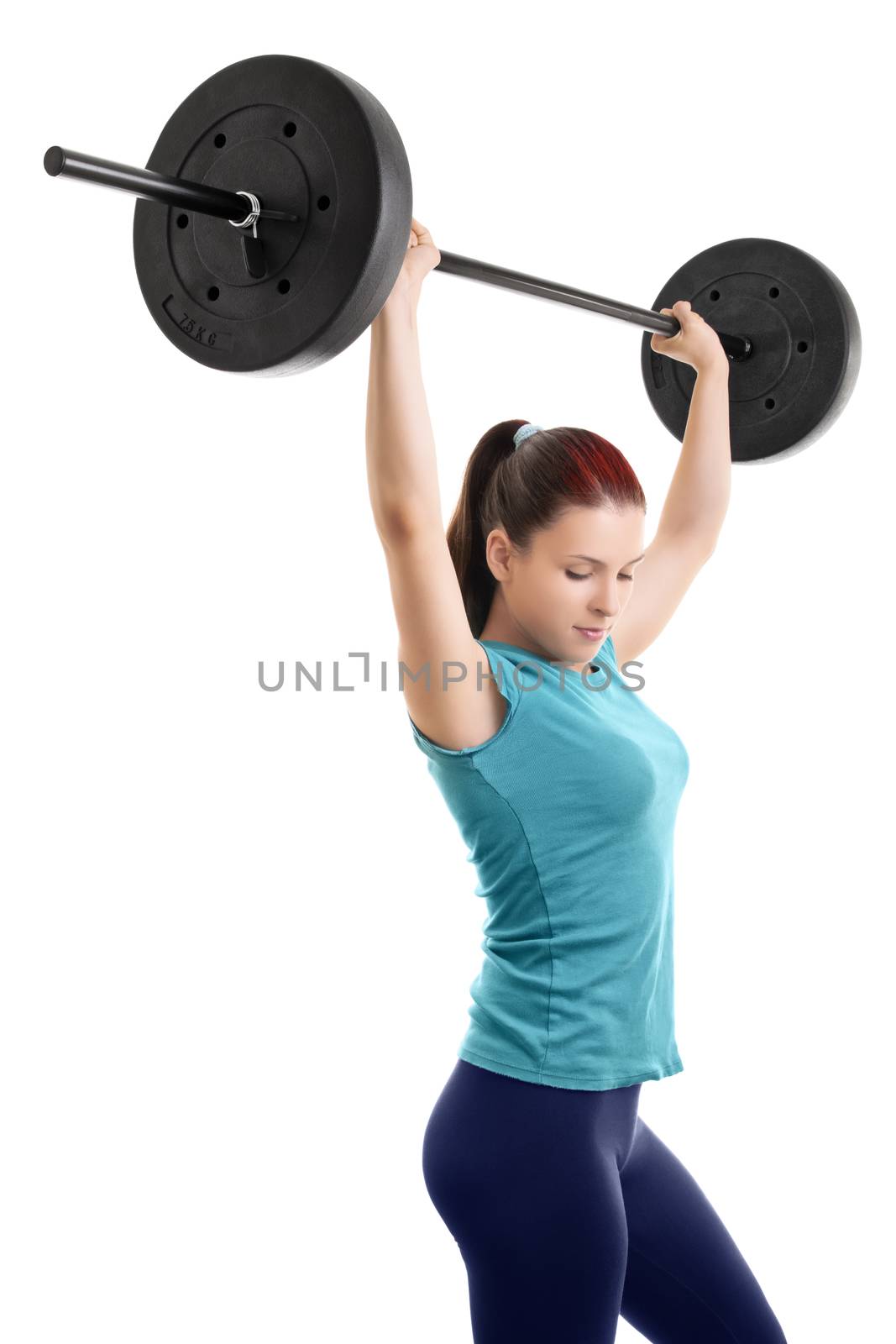 Beautiful young girl holding up a barbell, isolated on white background.