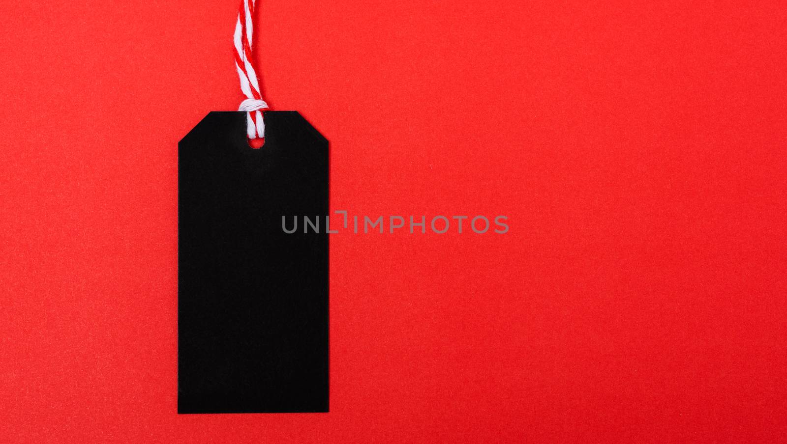 Promotion blank black tag label on red background