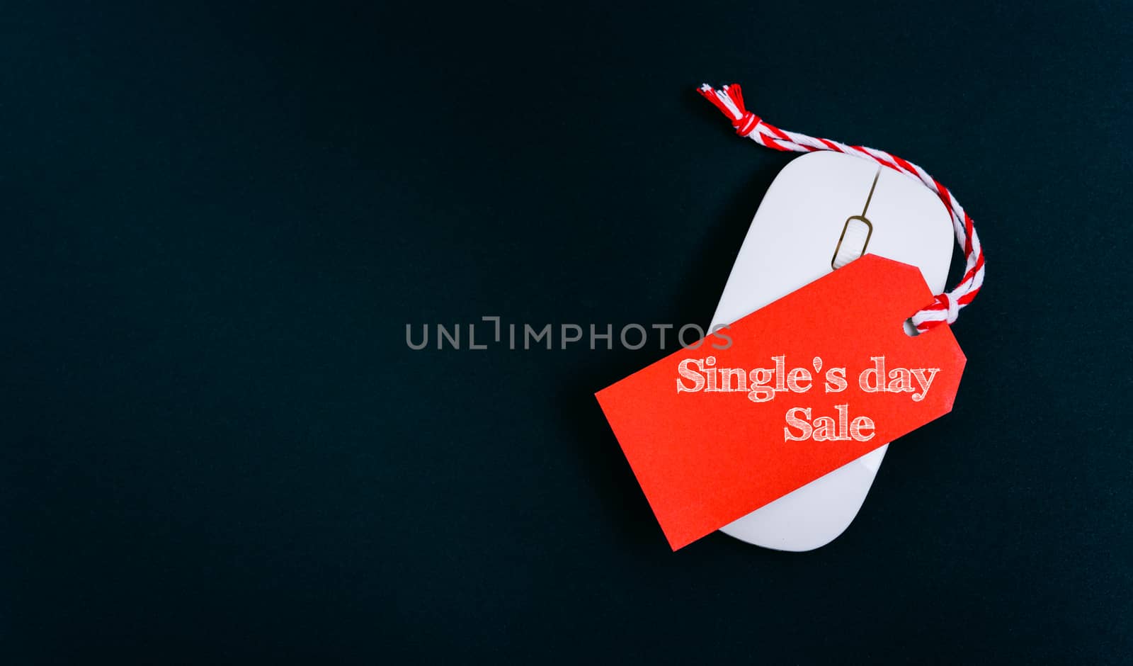 Online shopping Single's day sale text red tag on computer mouse with black background