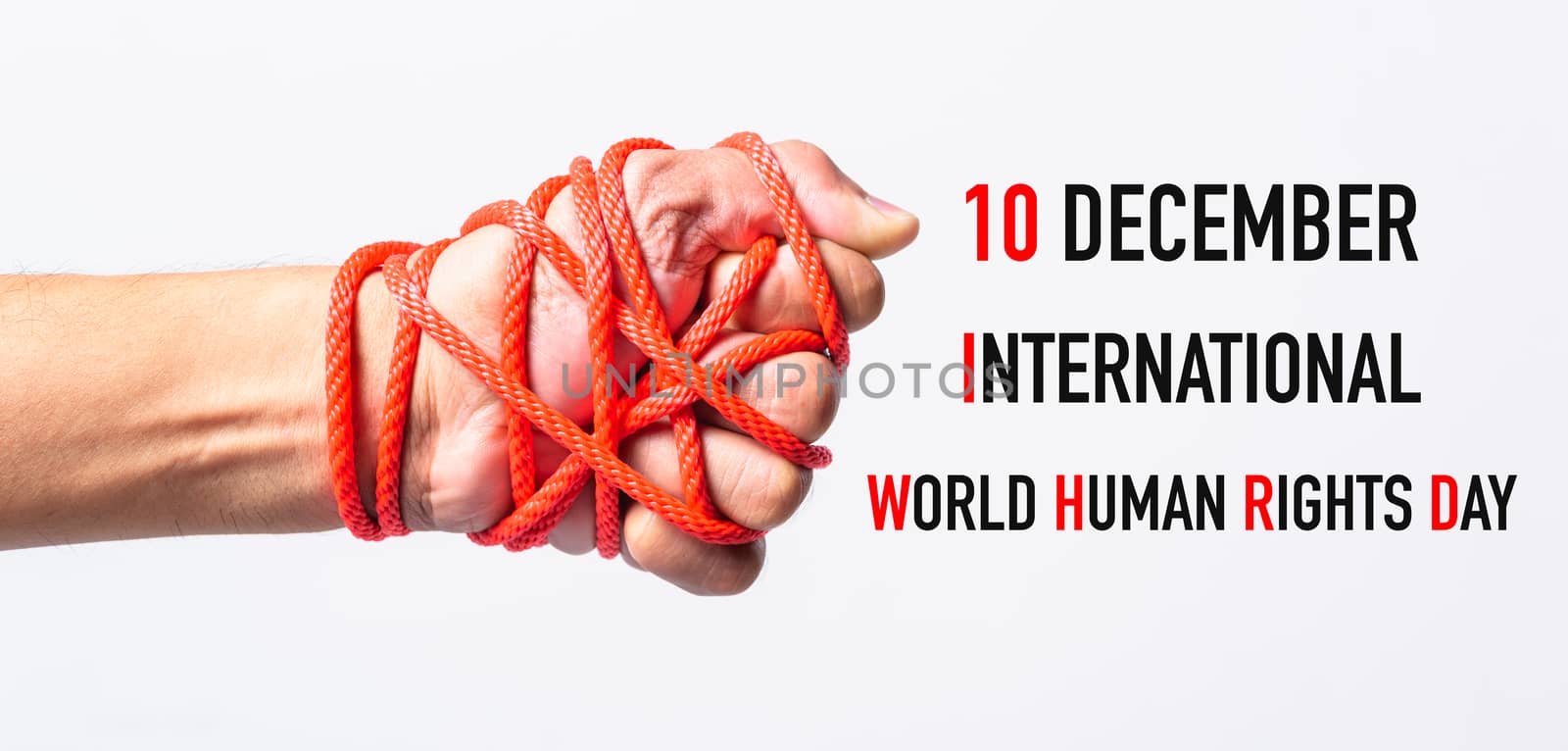 Red rope on lift hand with 10 december international HUMAN RIGHTS DAY text on white background, Human rights day concept