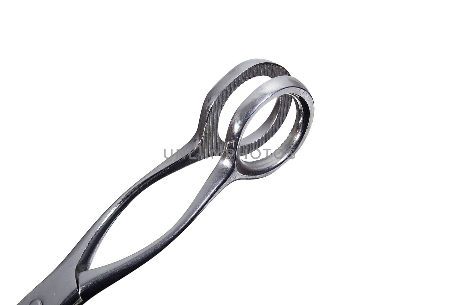 Metal surgical instrument on a gray background