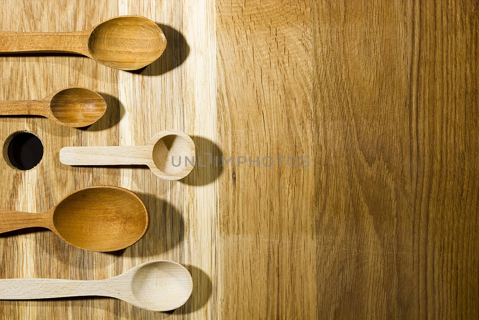 Set of wooden spoons on a cutting board