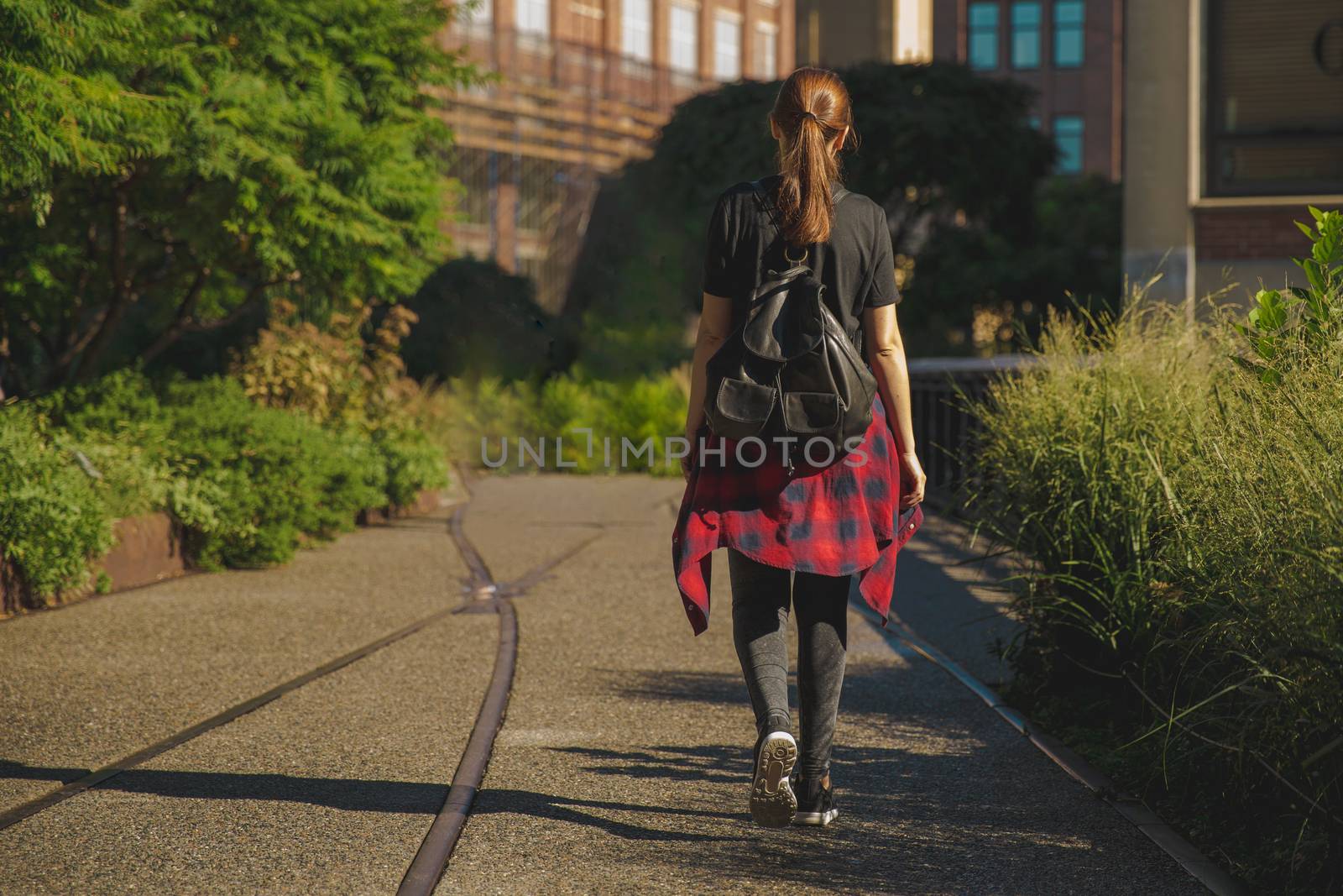 Beautiful woman walking on the HighLine Park, NYC