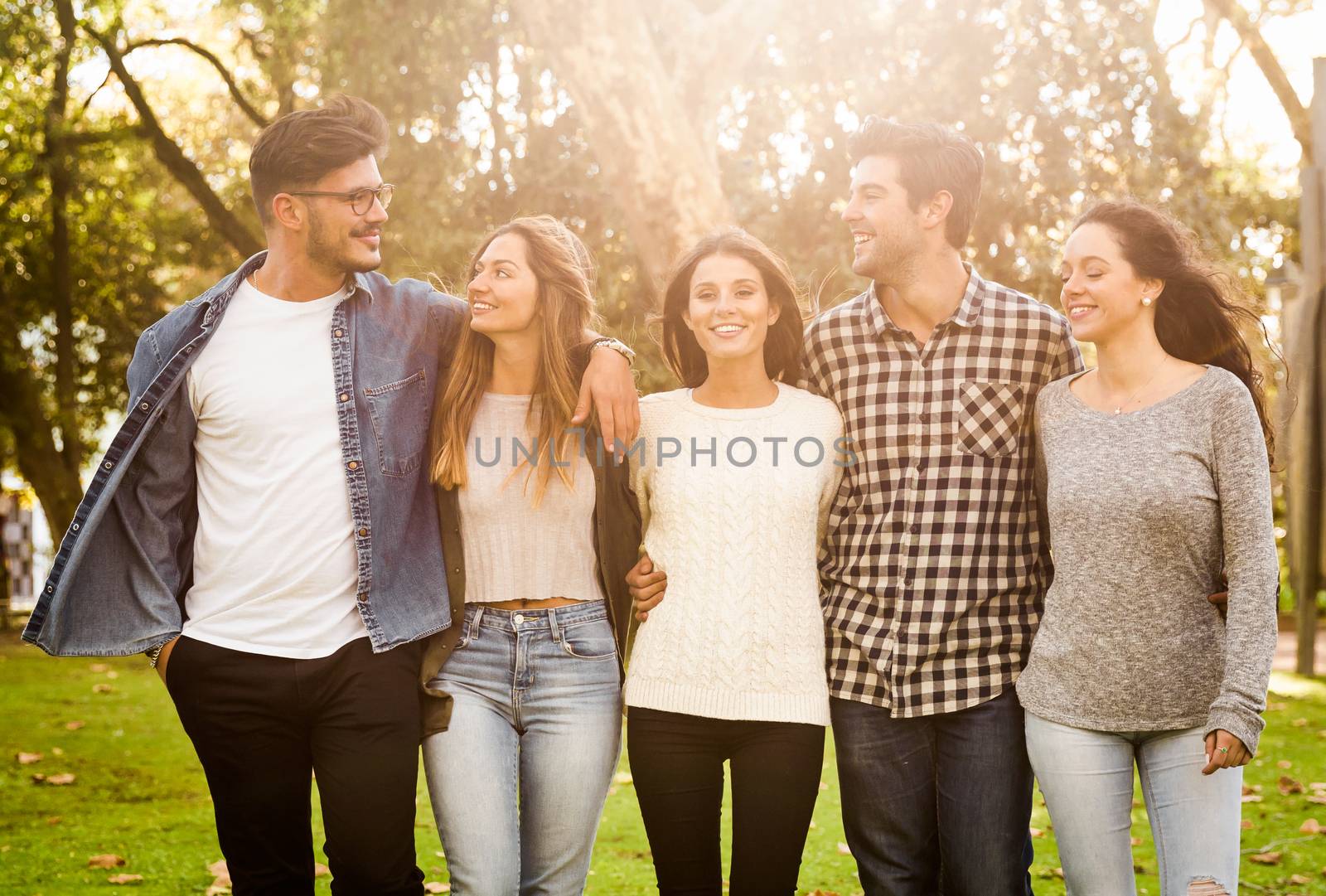 Group of students walking together in the park