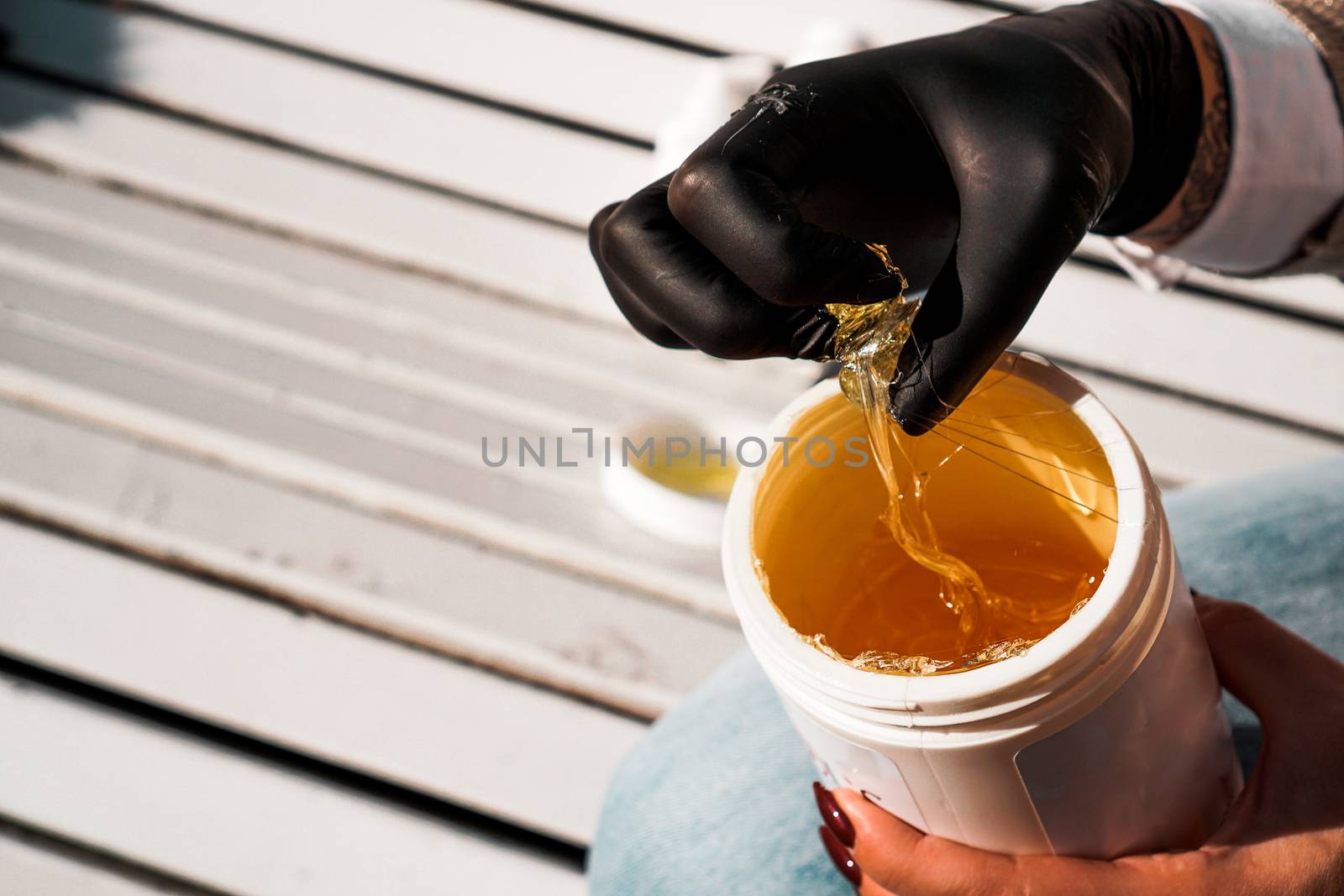 Natural honey sugar paste shugaring closeup by natali_brill