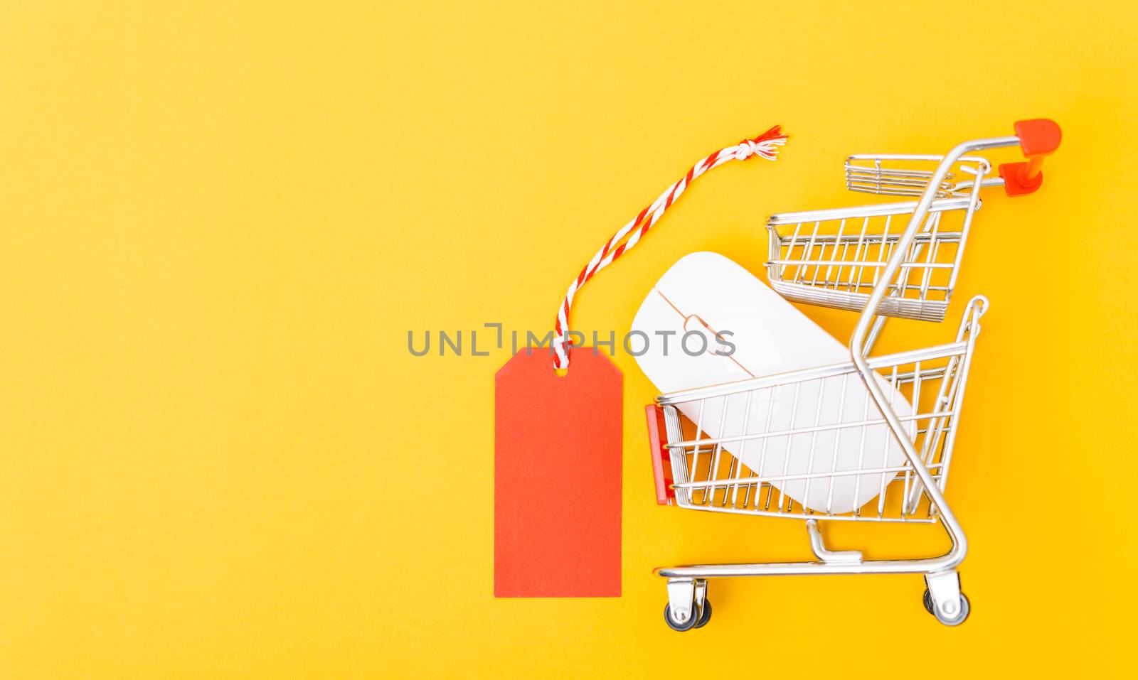 Blank red tag label have white mouse on cart shopping by Sorapop