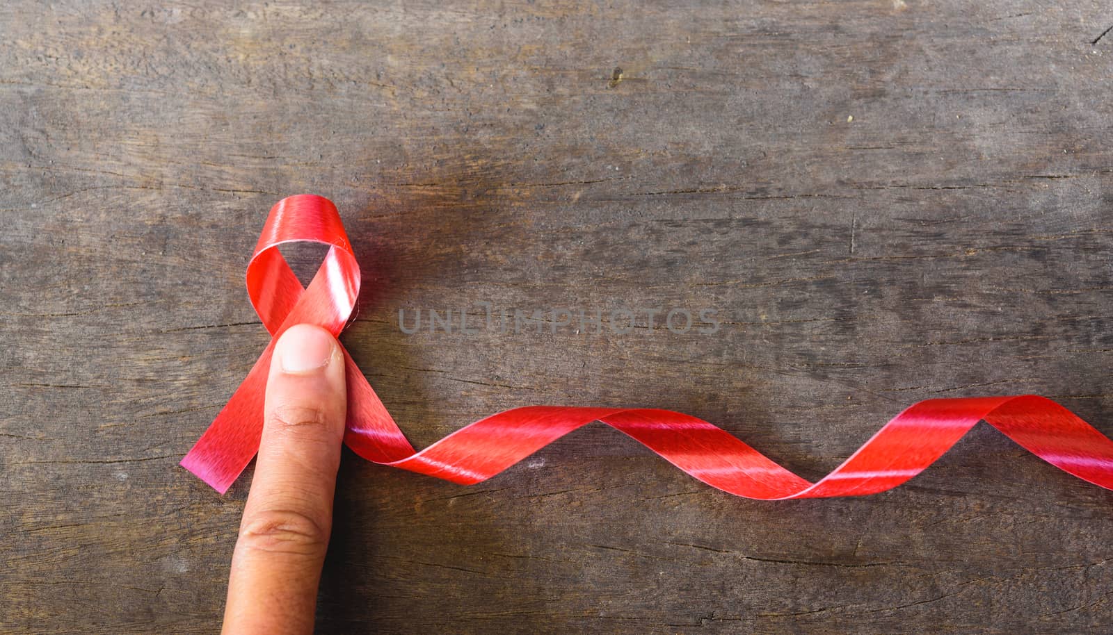 Red Ribbon Support HIV, AIDS and have finger by Sorapop