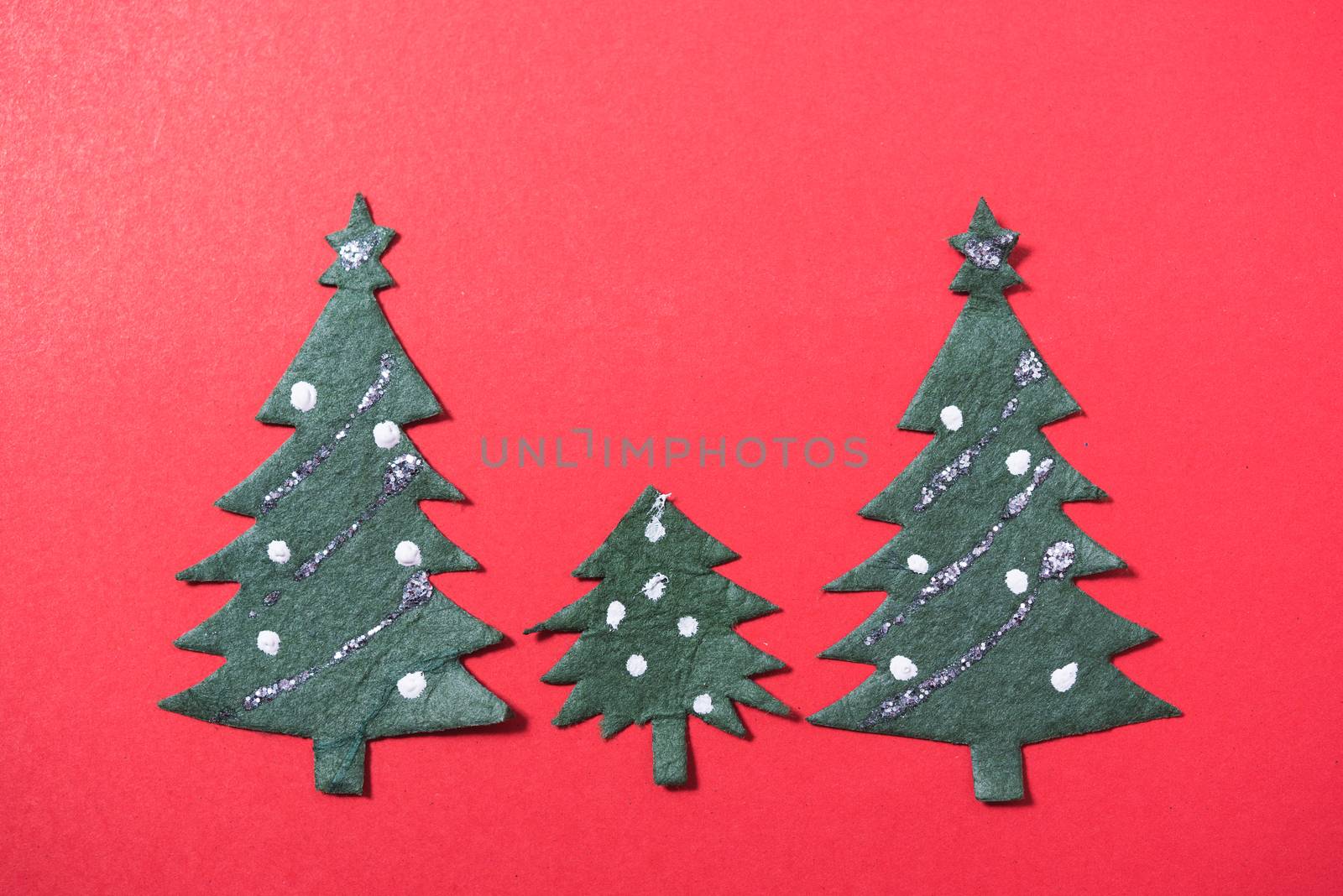 Christmas green tree on red background and have copy space for use