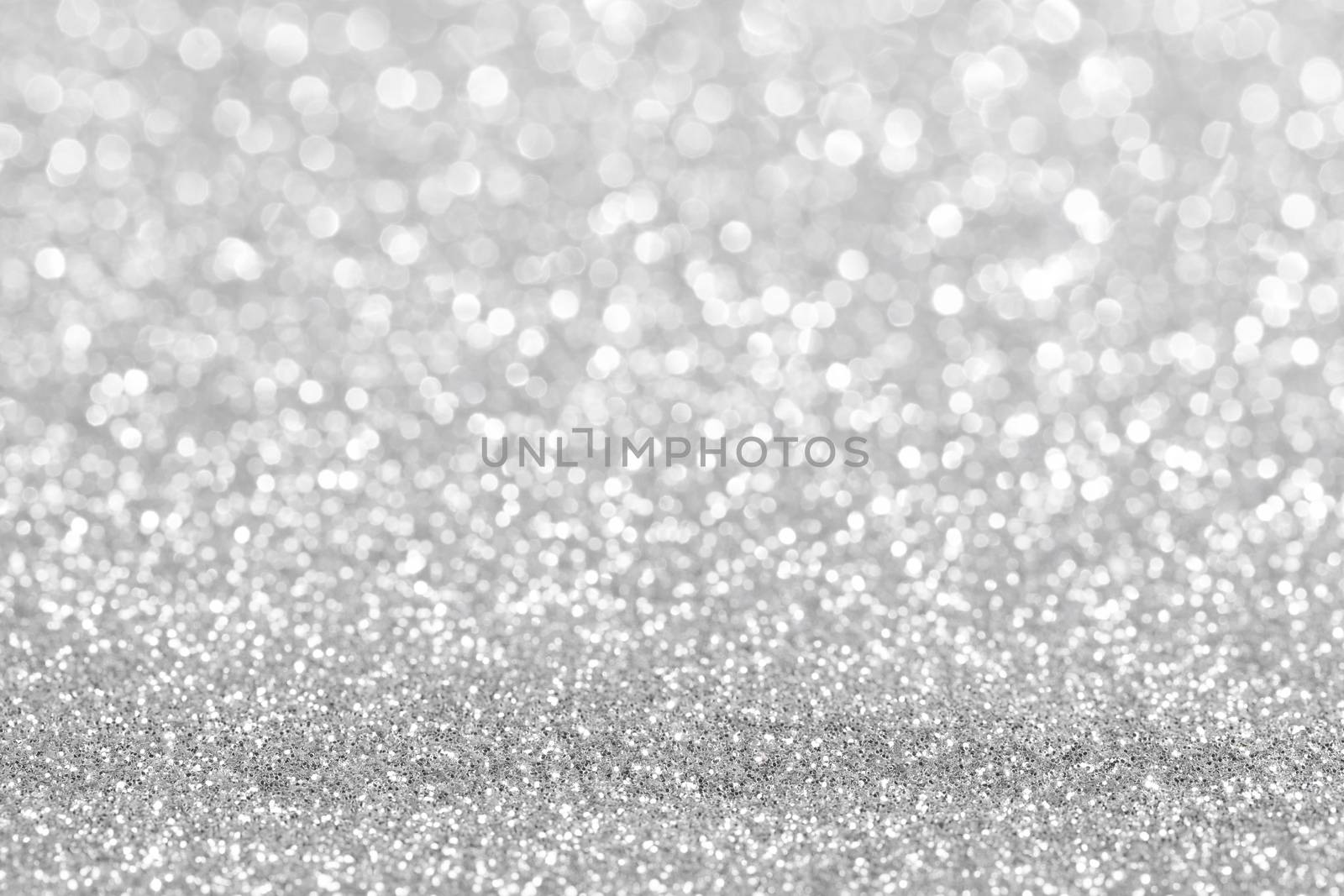 Shiny silver bokeh glitter lights abstract background, Christmas New Year party celebration concept