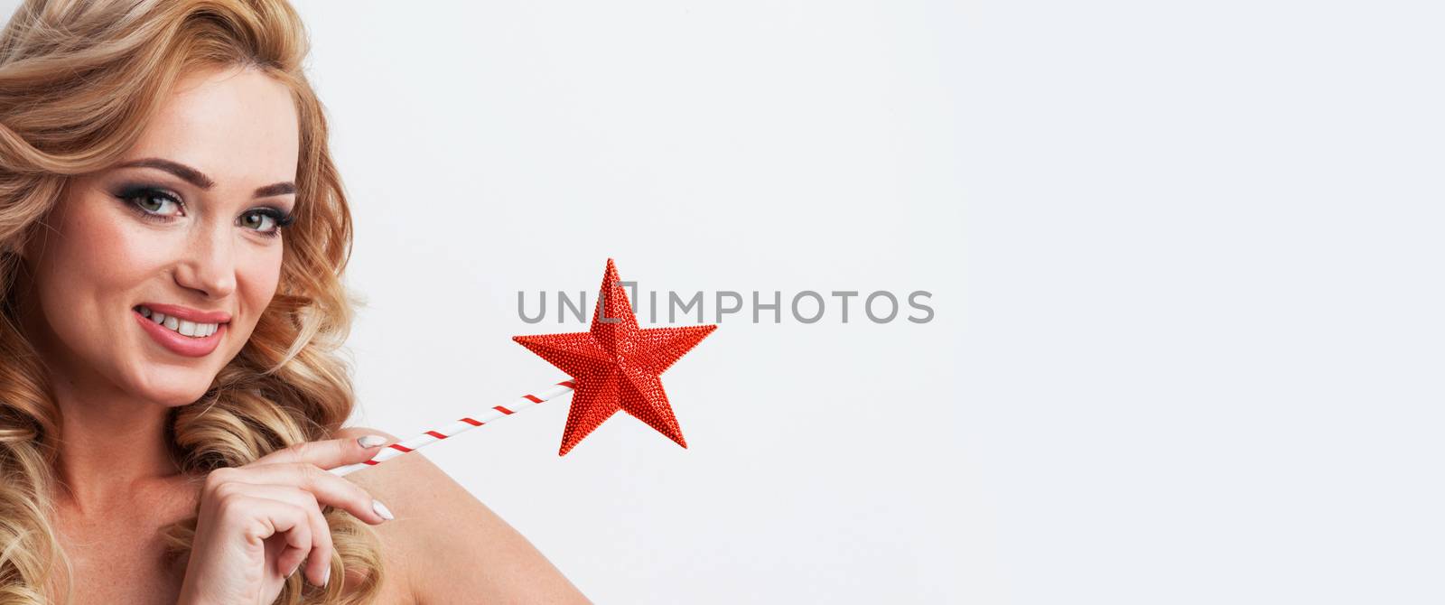 Fairy woman with magic wand with star pointing at white background with copy space for text