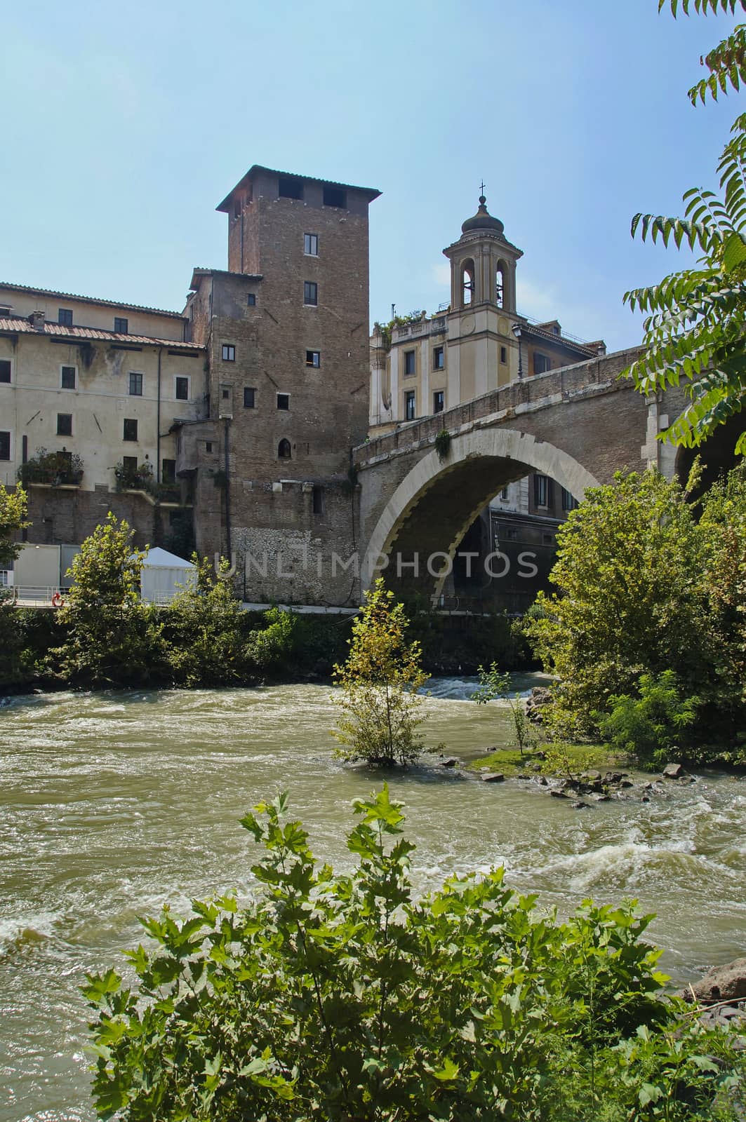 Photo of Castello Caetani Historical landmark, river Tiber and Ponte Fabricio bridge, view from Lungotevere de' Cenci, Rome, Italy
