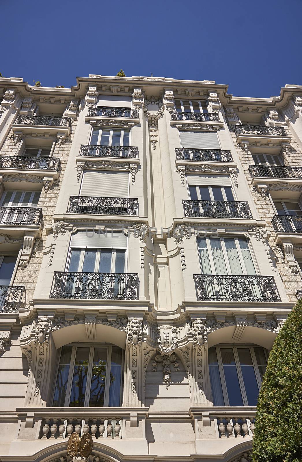 example of a baroque-style building on the nicely decorated three-story windows and balconies with numerous decorations typical of this architectural style.