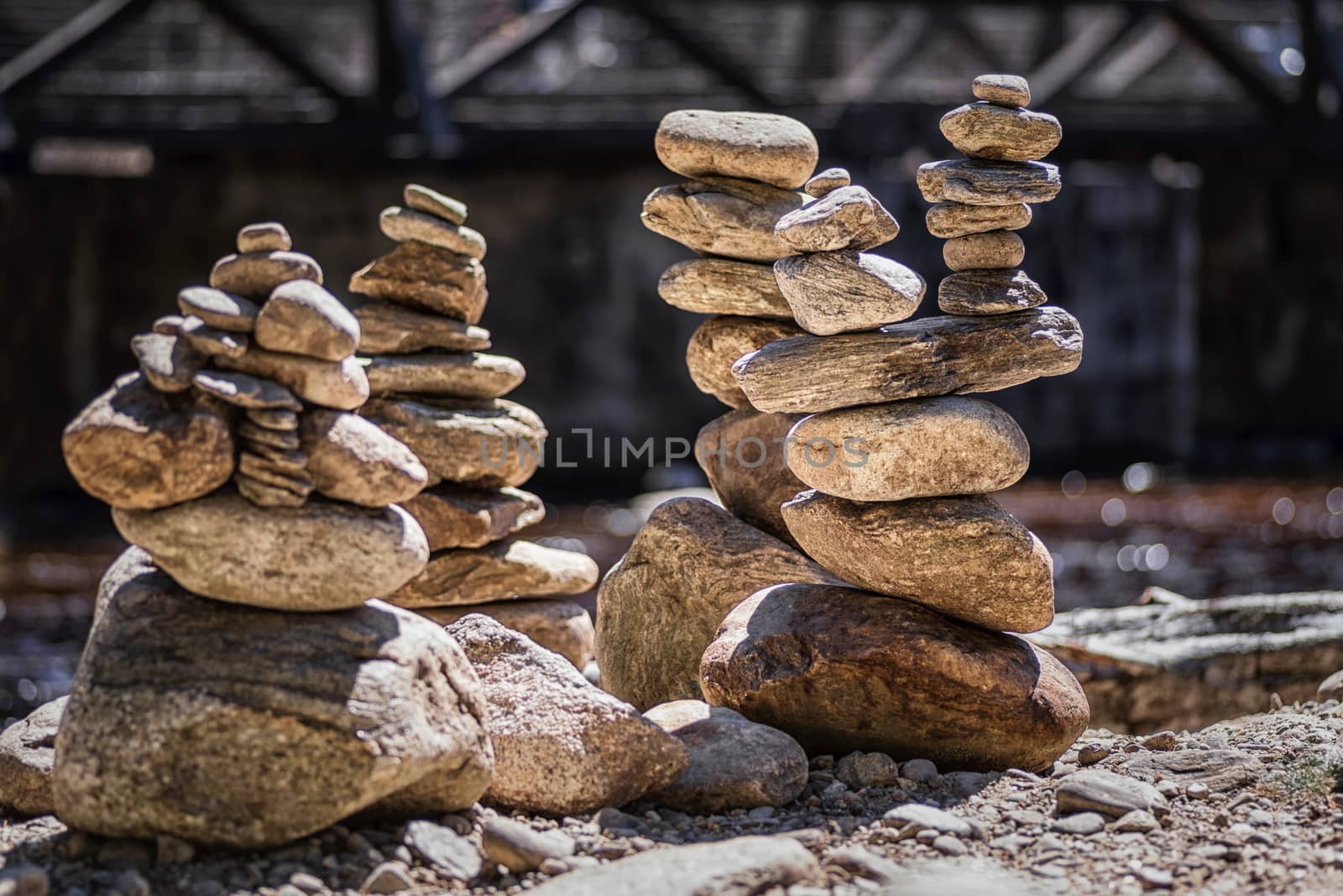 Rocks Stacked Close Up in a river bed.Stack of pebbles. Balancing on a river background.