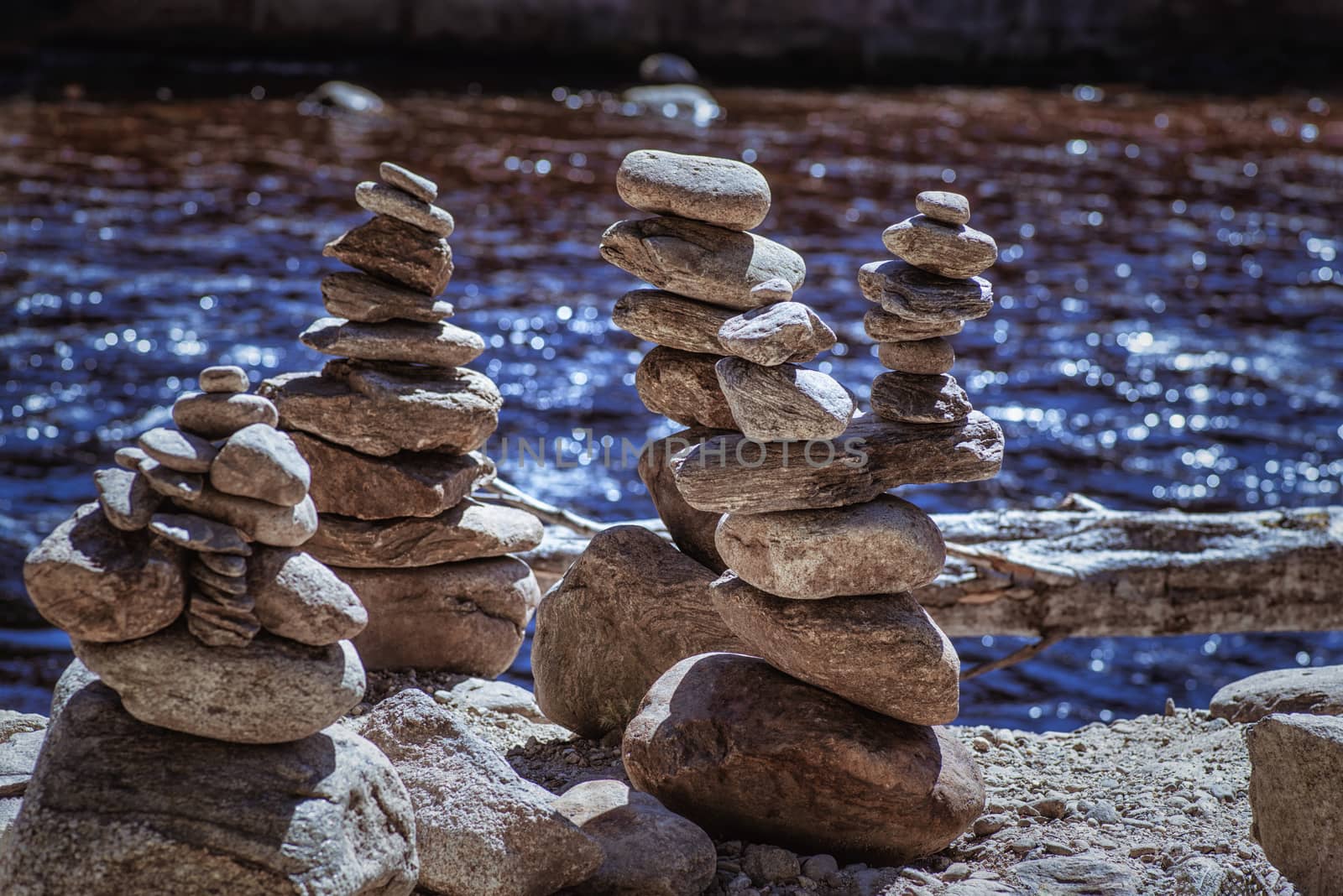 Rocks Stacked Close Up in a river bed.Stack of pebbles. Balancing on a river background.