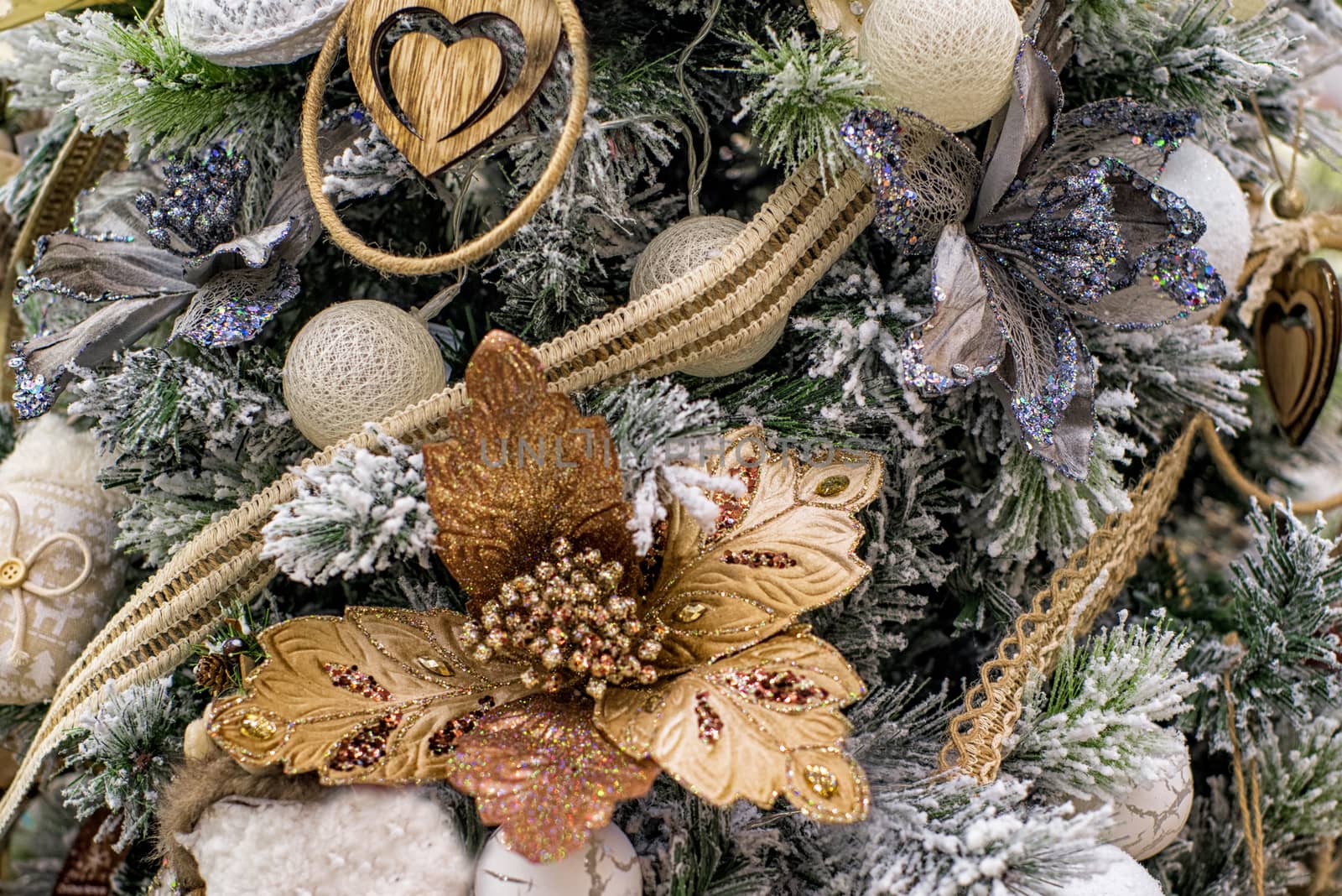 The decor on the Christmas tree on which the New Year's toys are hanging . Xmas concept. soft selective focus