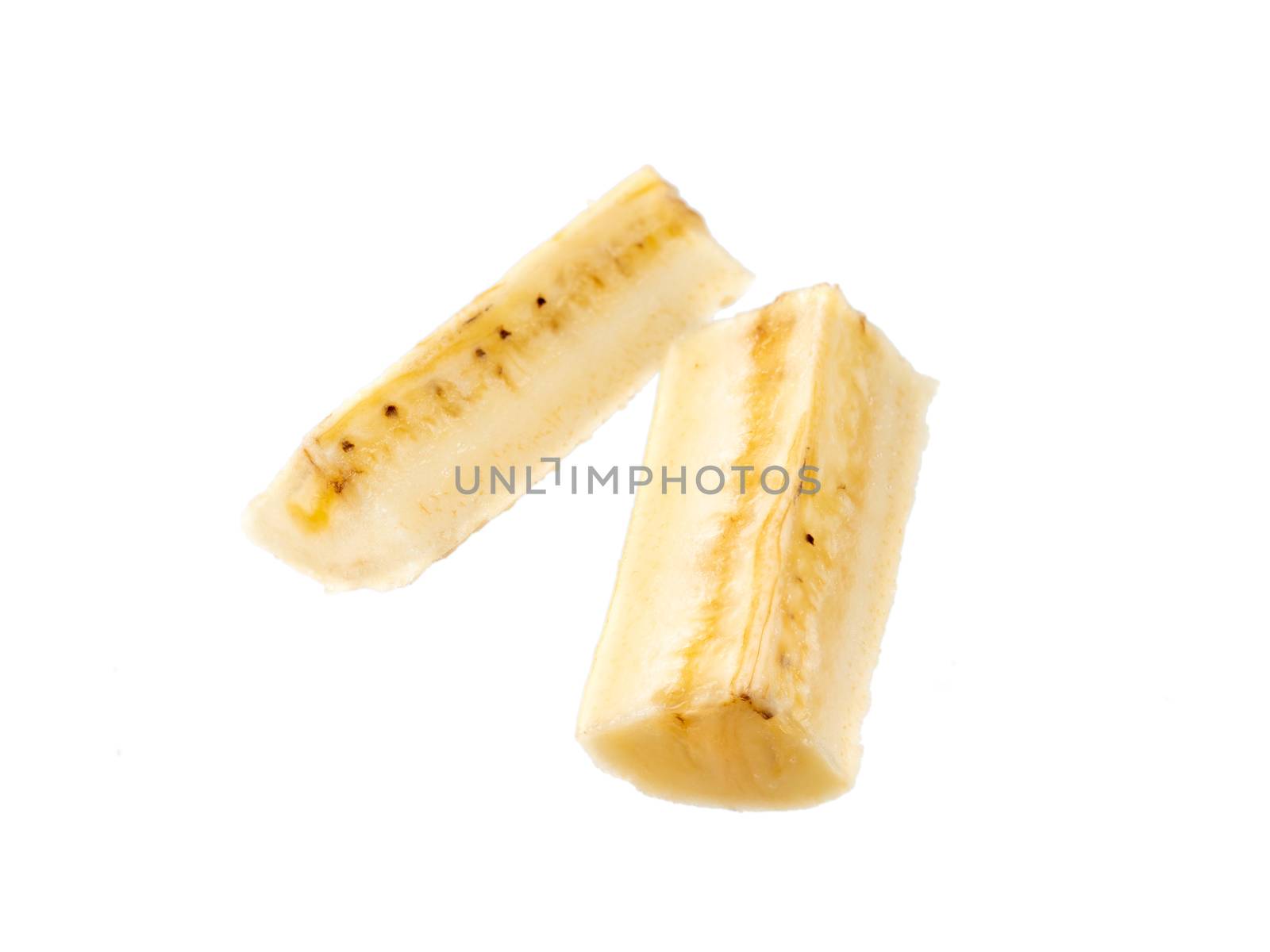 Two banana fourth slices, isolated on white background with clipping path. Extreme close up, studio shoot.
