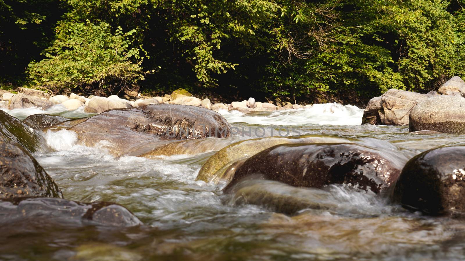 Rocky Stream Running Water. Stones in the water. Natural background