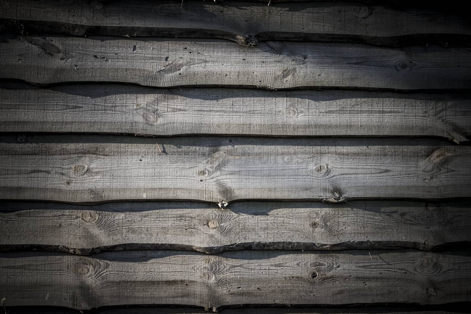 Old dark wood plank background. Wall floor or fence exterior design. Natural wooden material backdrop