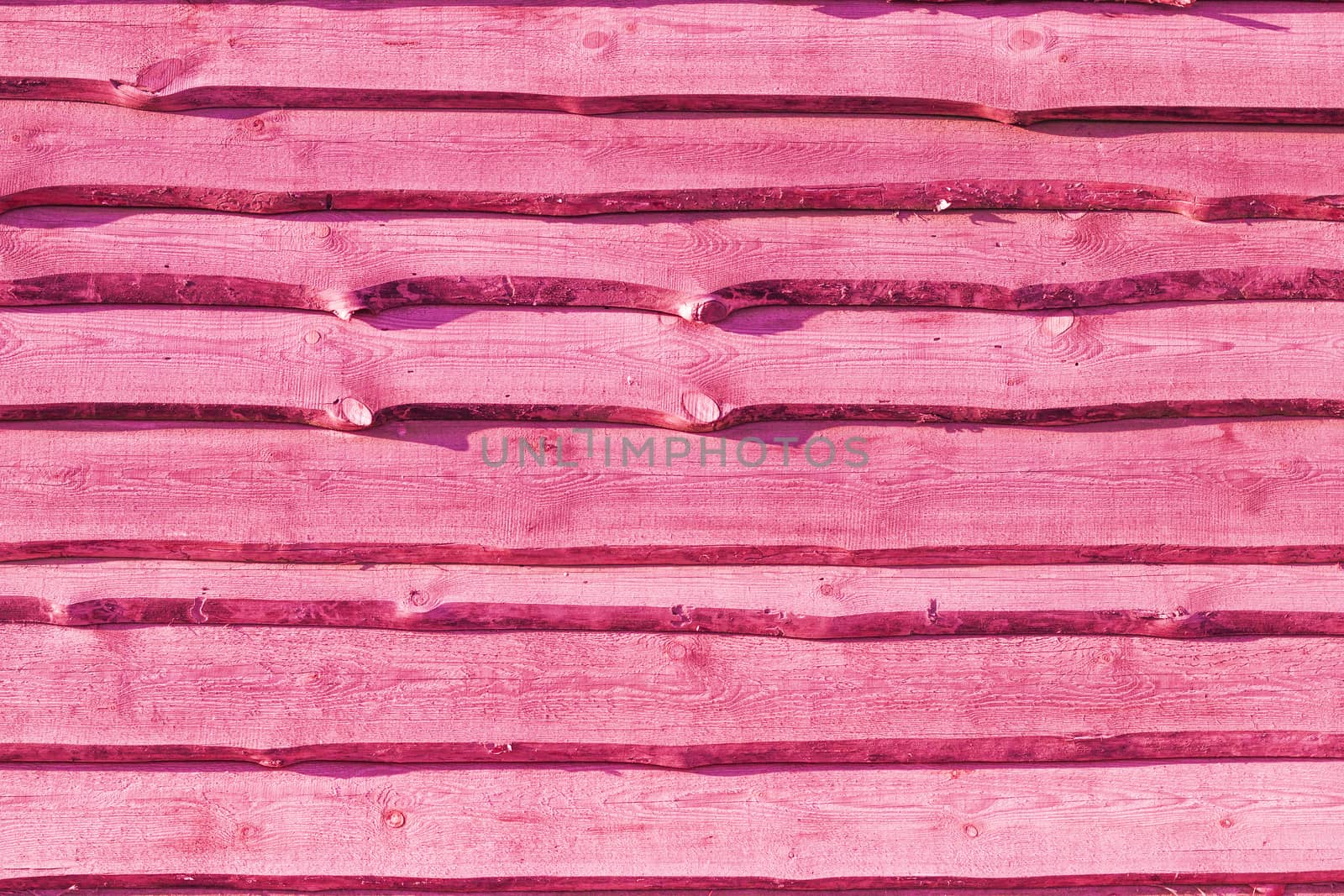 Old pink wood plank background. Wall floor or fence exterior design. Natural wooden material backdrop