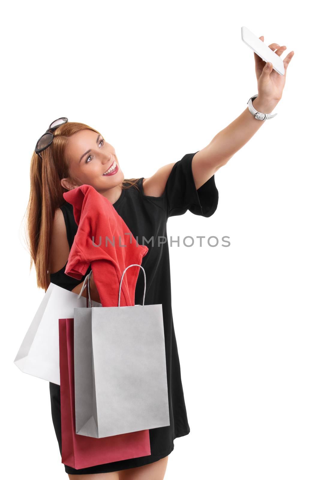 Girl taking a selfie with her shopping bags by Mendelex