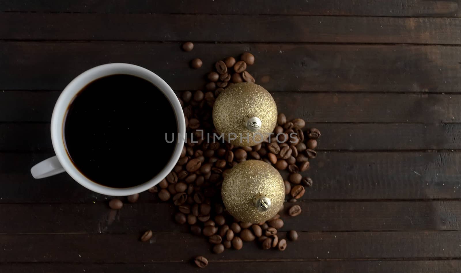 Cup of coffee with coffee beans and two pair Christmas balls .Christmas concept. by andre_dechapelle