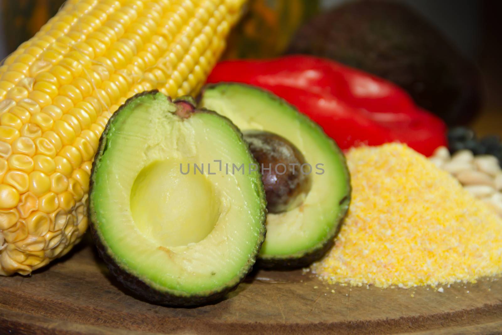 corn meal with avocado and other Mexican food ingredients by GabrielaBertolini