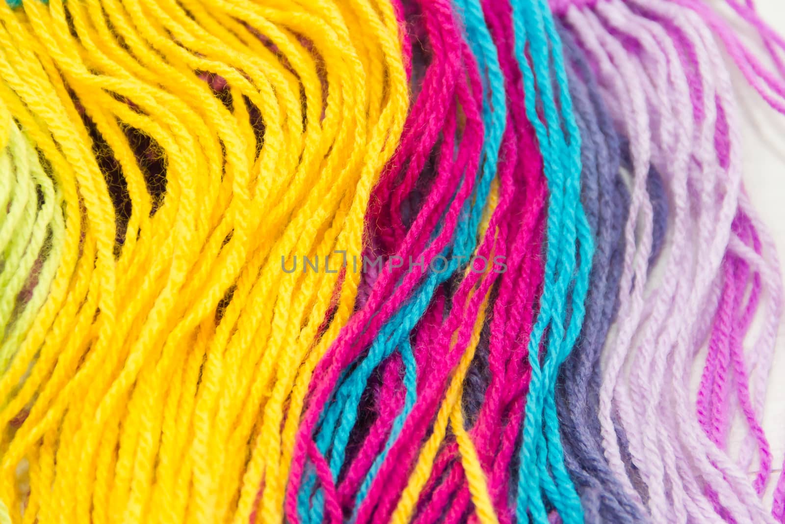 textured background of colorful woolen threads