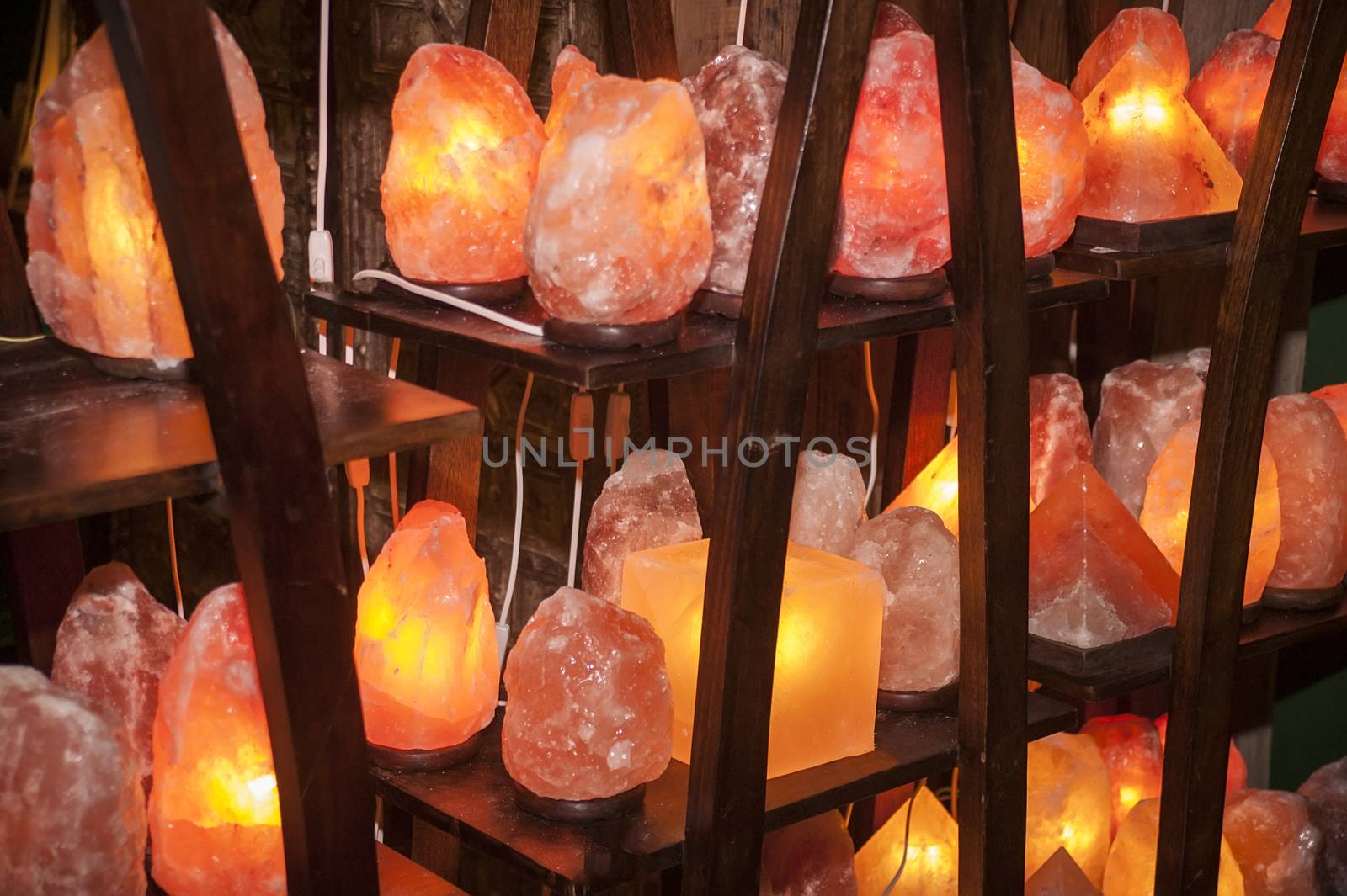 Shelves full of Himalayan salt lamps of all shapes and sizes ready to be sold.