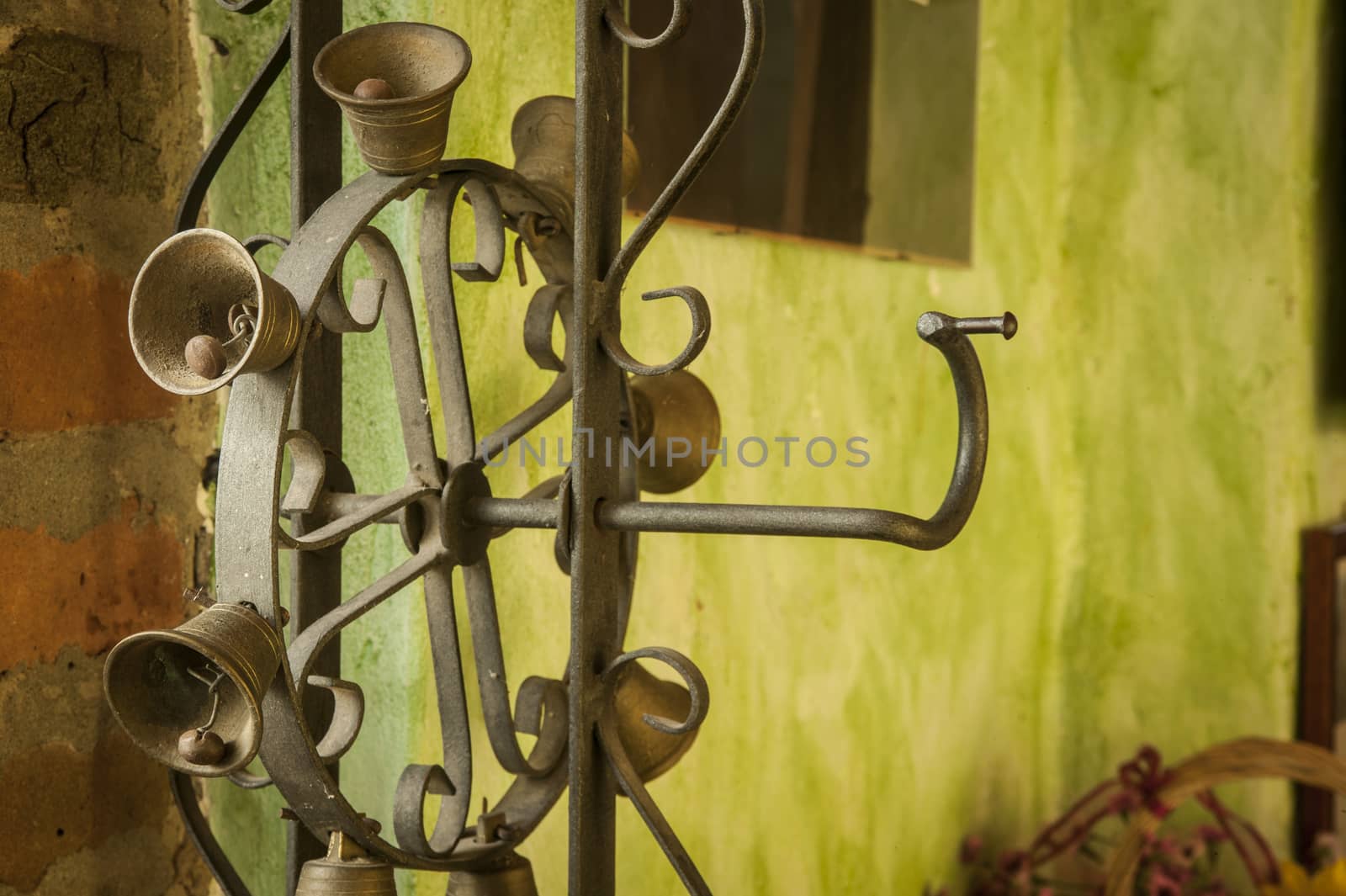 Object for furniture with wrought iron bells used to furnish a rustic tavern
