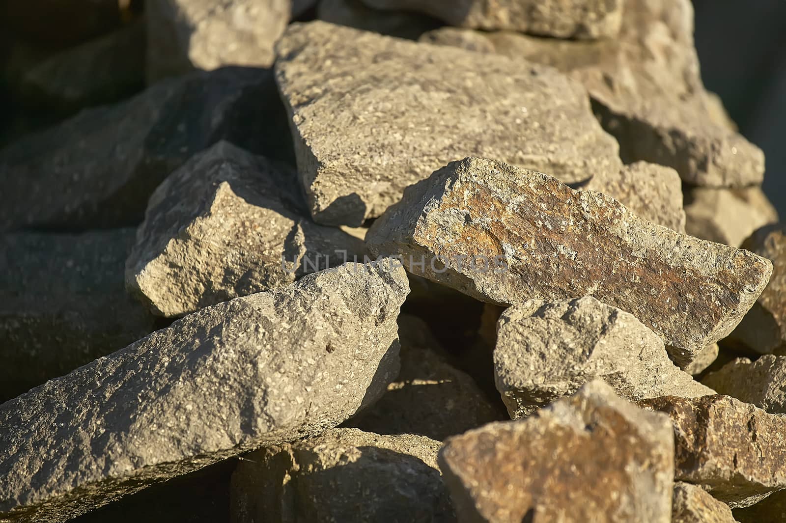 Group of rocks illuminated by the setting sun: ideal image as a background for graphic projects.