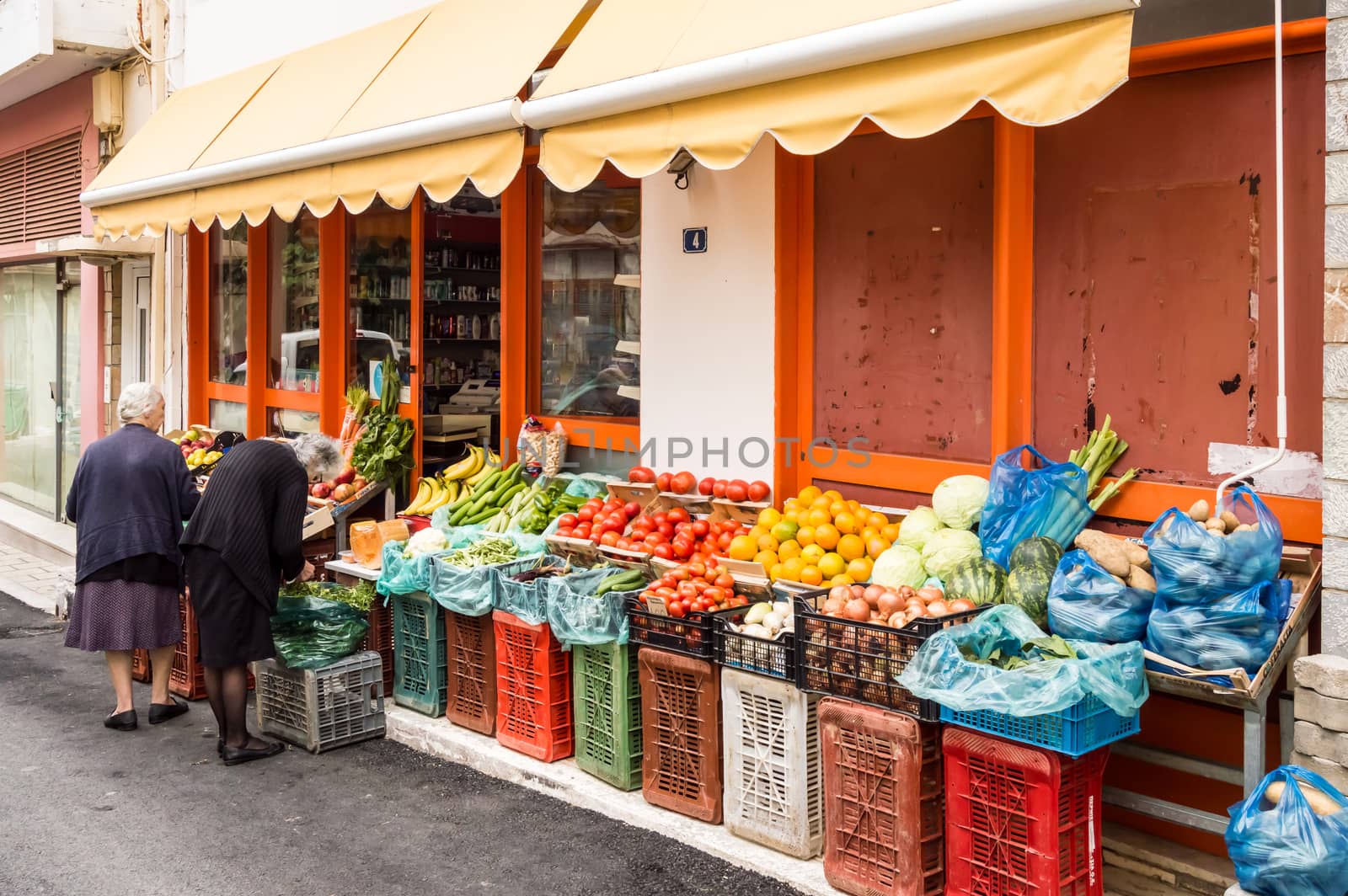 Large amount of fruits displayed in a market with many colors and variety