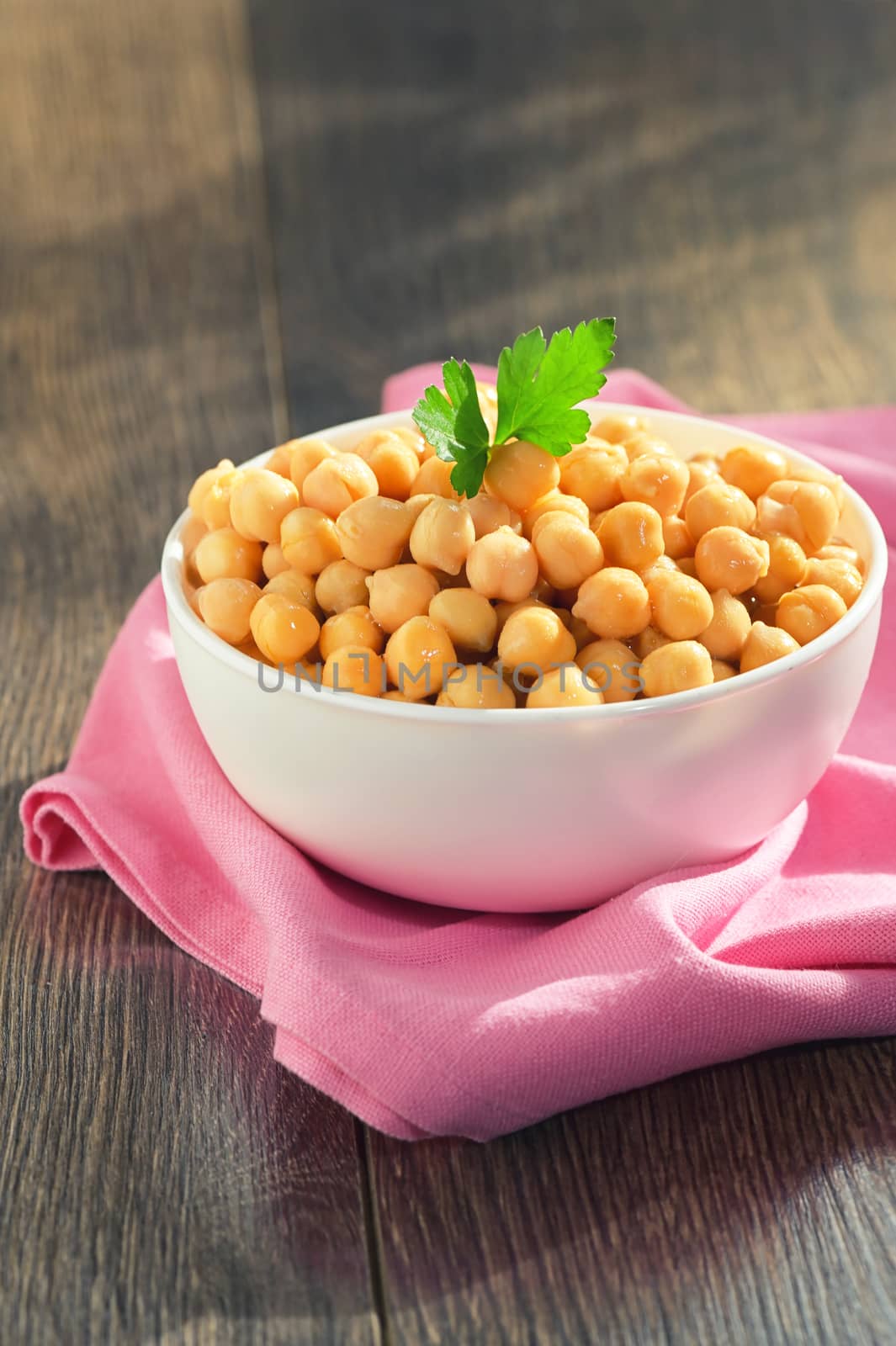 Cooked Chickpeas In Ceramic Bowl on wooden table