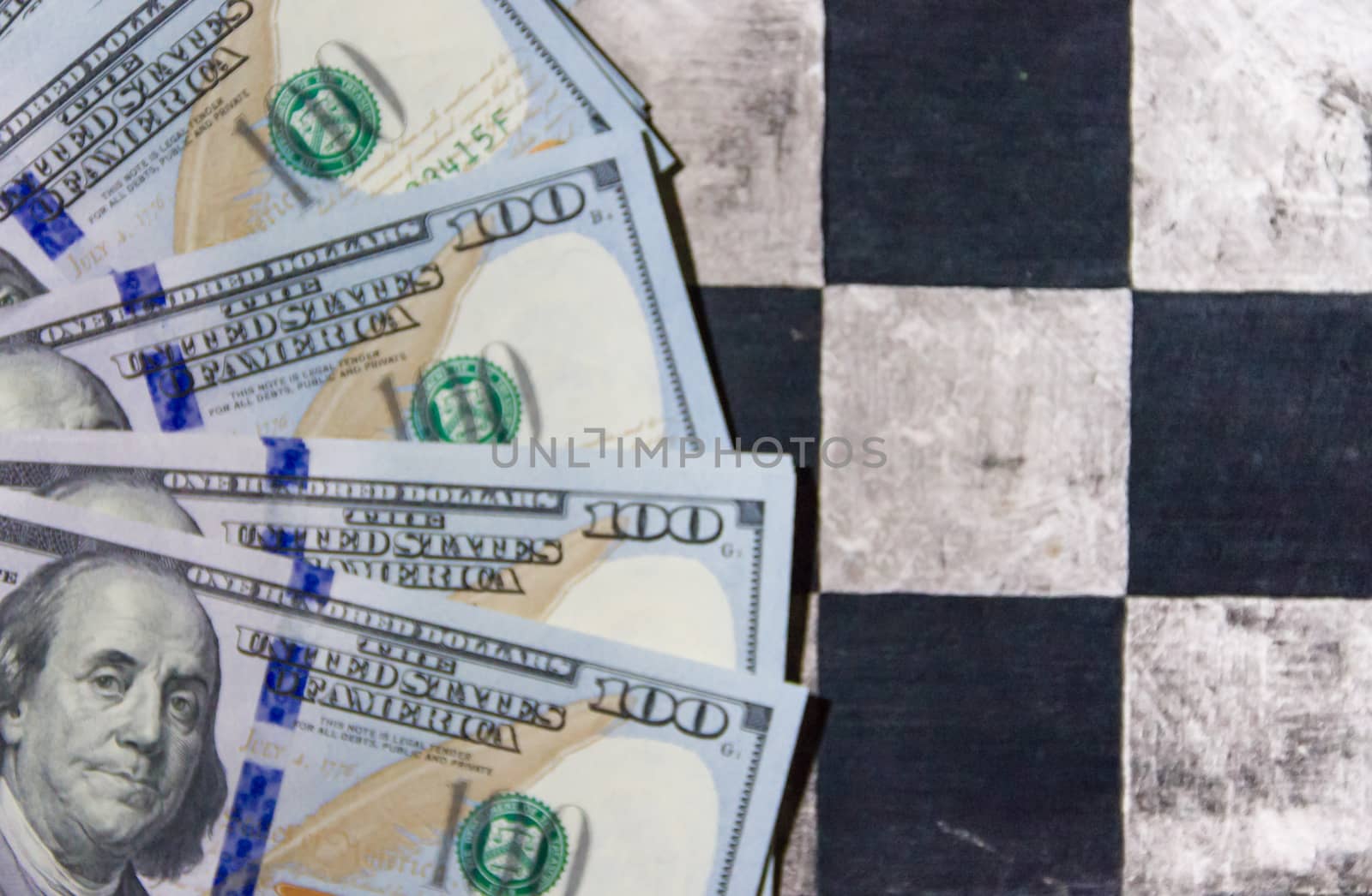 finance concept with dollar bills on chessboard by GabrielaBertolini