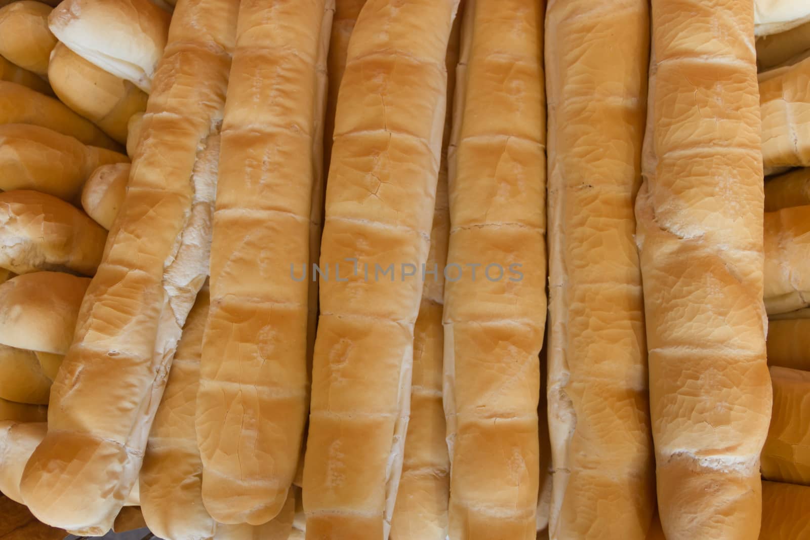 background of baked wheat flour breads in the field