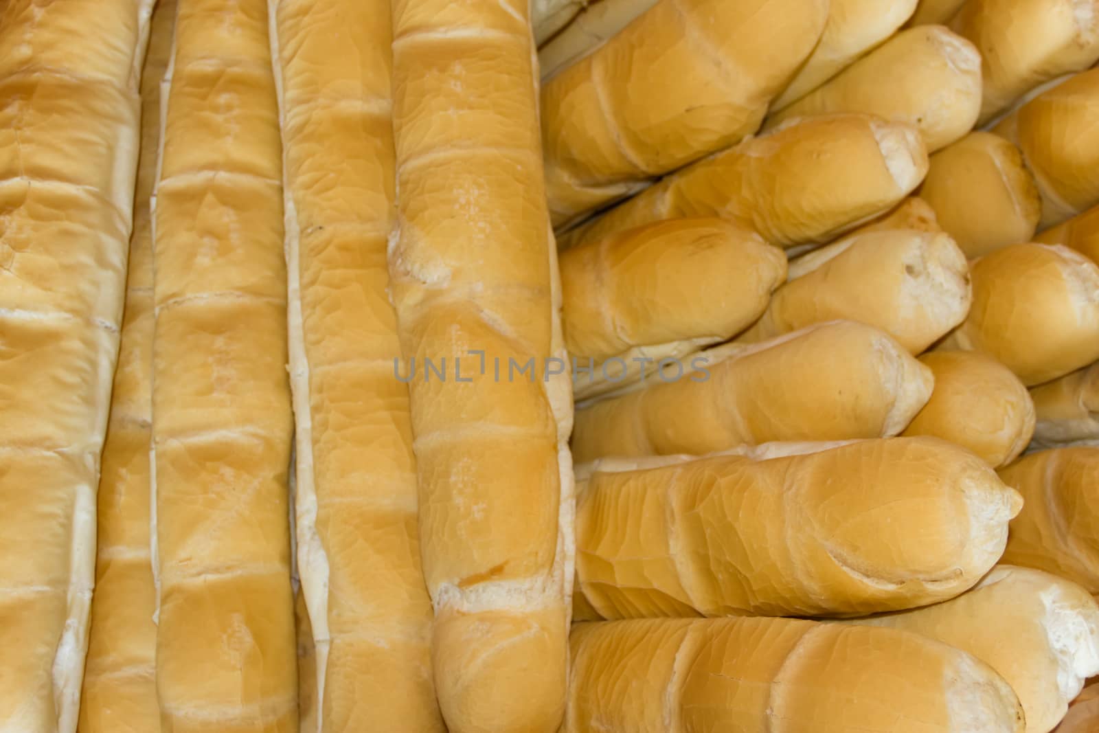 background of baked wheat flour breads in the field
