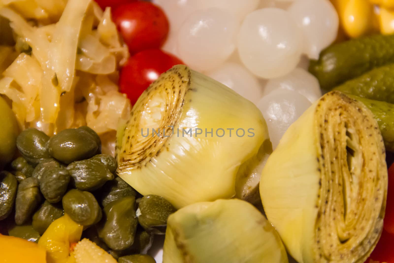 artichoke hearts and other vegetables pickled in vinegar