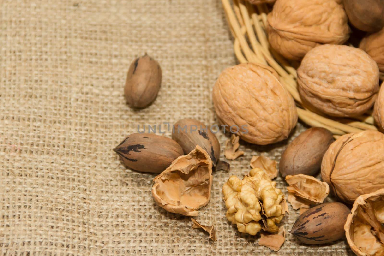variety of healthy nuts on rustic background by GabrielaBertolini