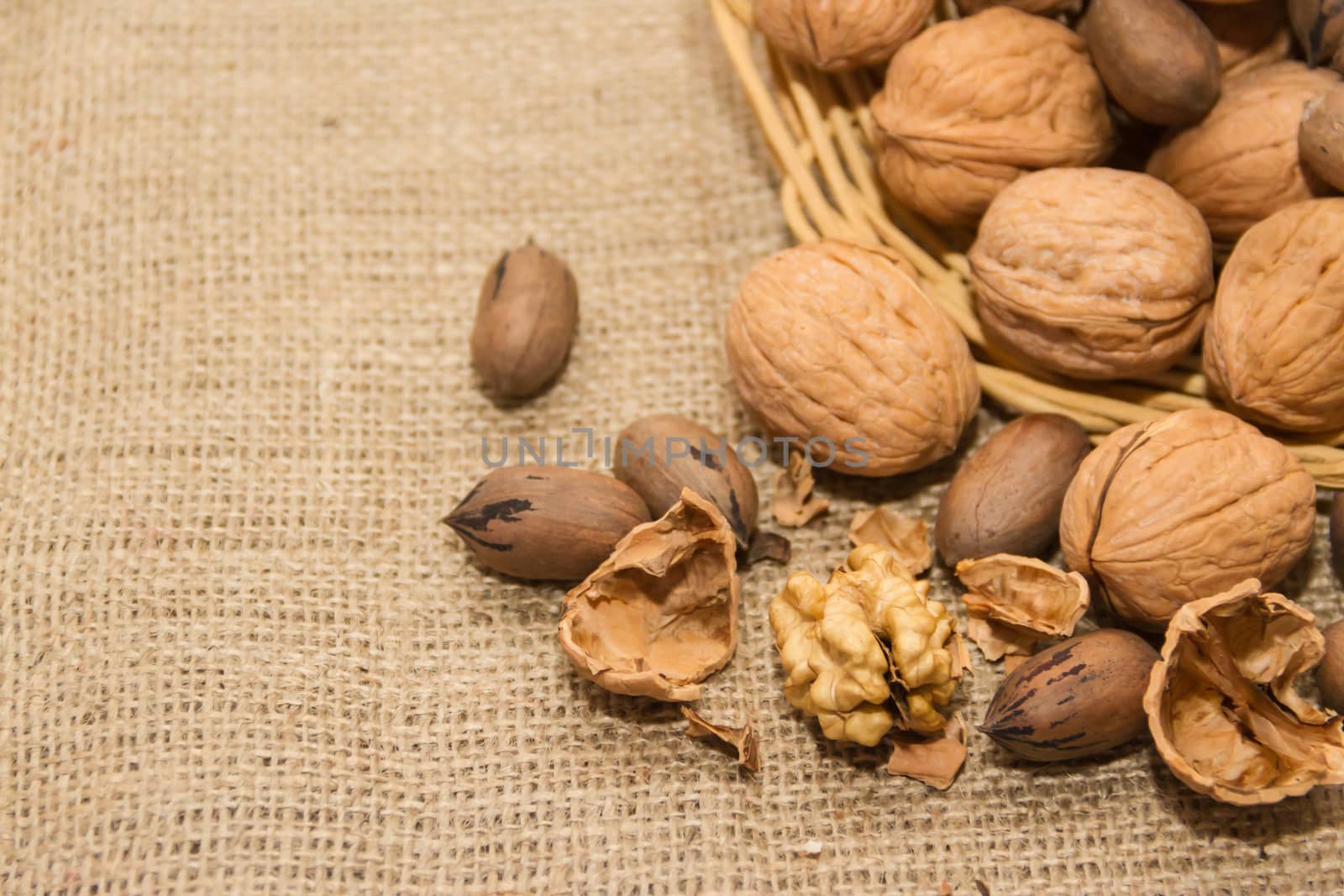 variety of healthy nuts on rustic background by GabrielaBertolini