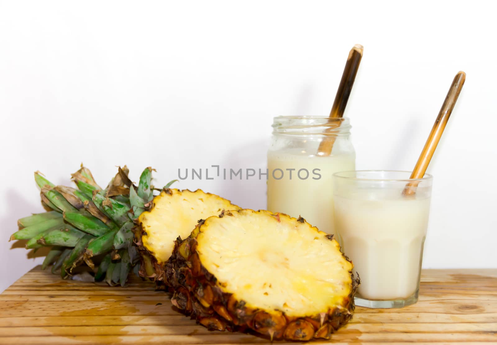 glasses with juice pineapple drinks and smoothies fresh pineapple by GabrielaBertolini